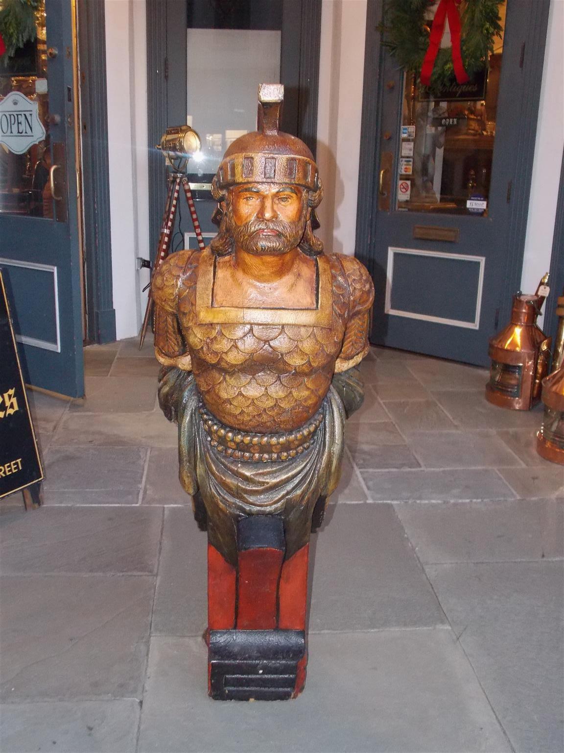 American gilt carved wood and poly chromed nautical figurehead of Roman guard in military attire. Late 19th century.