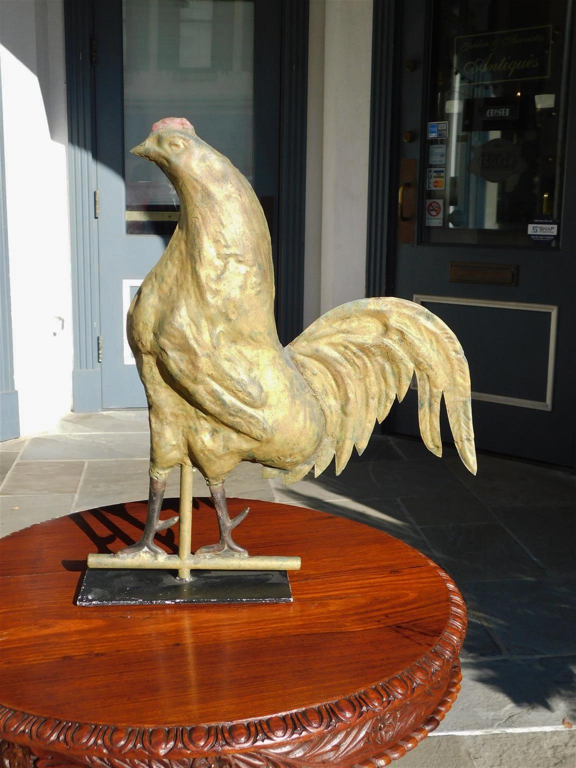 American gilt copper and cast iron full bodied rooster weathervane mounted on stand, Late 19th Century