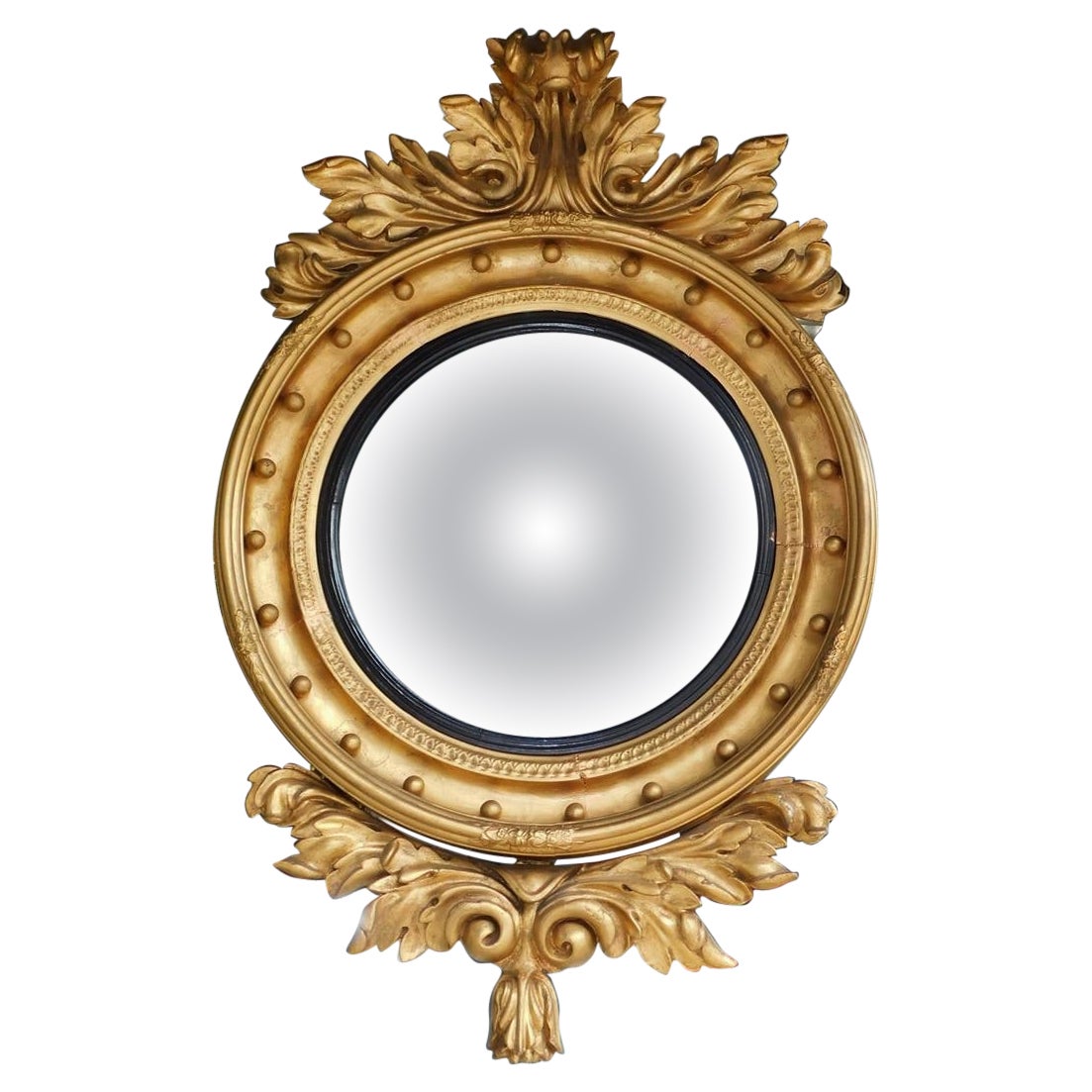 Specchio da parete convesso americano in legno dorato e fogliame ebanizzato, circa 1825