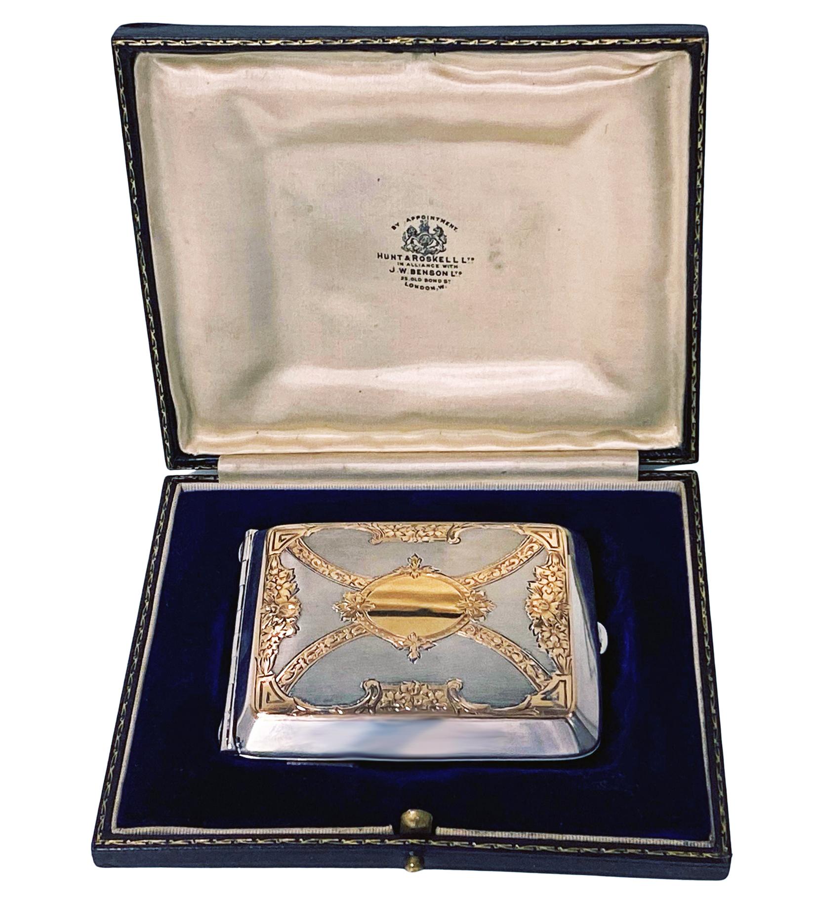 American Gold and Sterling Silver Cigarette Fraternity Box, Watrous C.1920. This very unusual box of rectangular concave shape, the front with gold inlaid rosette foliage decoration and vacant gold cartouche against sterling stippled background. The