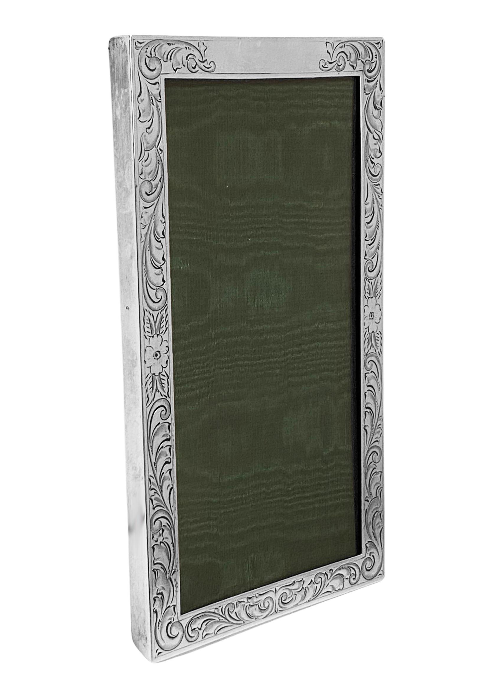 American Gorham sterling silver photograph frame, circa 1900. Rectangular foliate engraved surround decoration. Original back and glass. Silver in very good condition and good thick gauge to silver. Orginal dark green velvet back and green satin