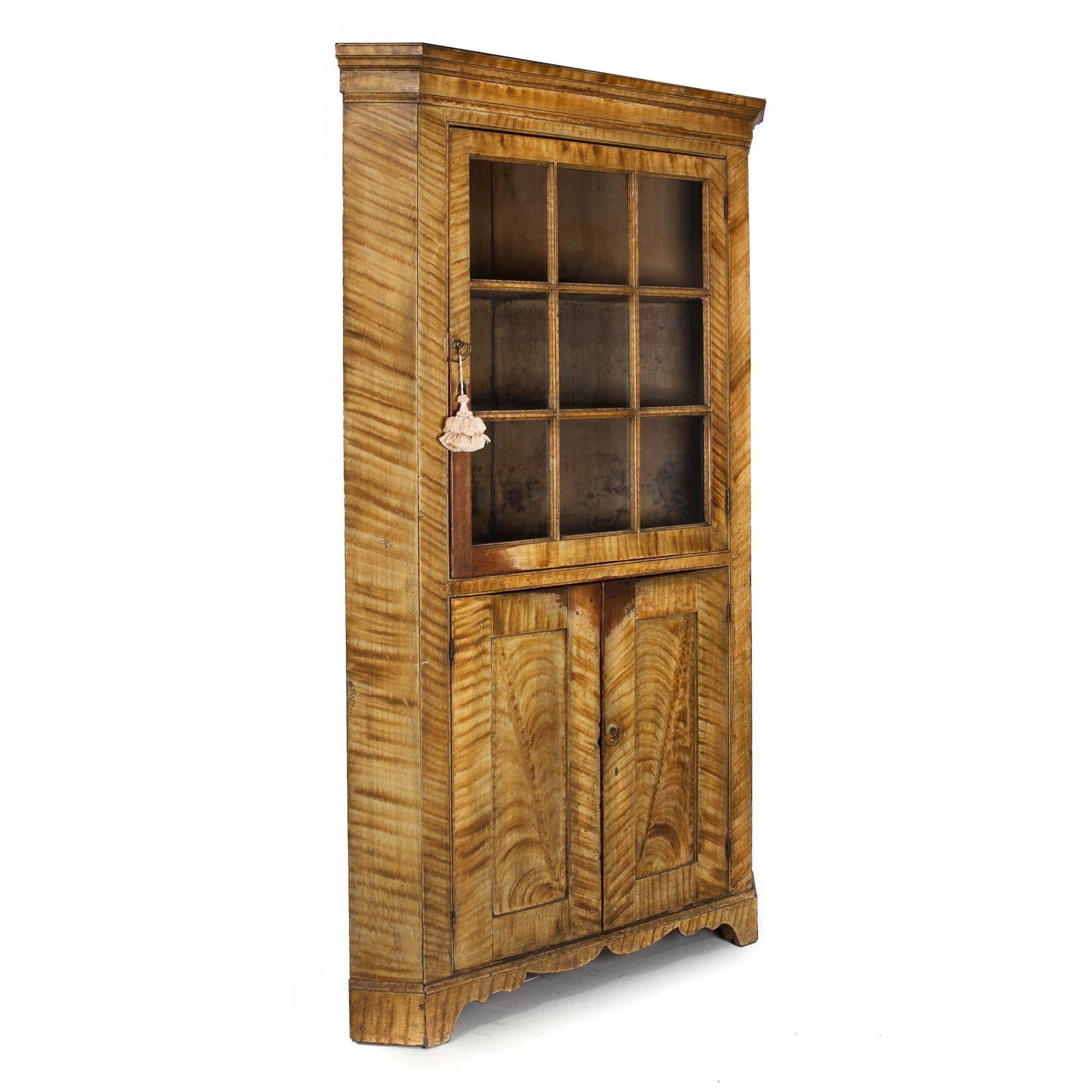 A VERY FINE AMERICAN GRAIN-PAINTED ONE-PIECE CORNER CUPBOARD
New England, circa 1805
Item # 305PXF05C 

An incredibly fine one-piece corner cupboard formerly acquired at Sotheby's in 2013 for $ 15,000. The original and beautifully worn surface is