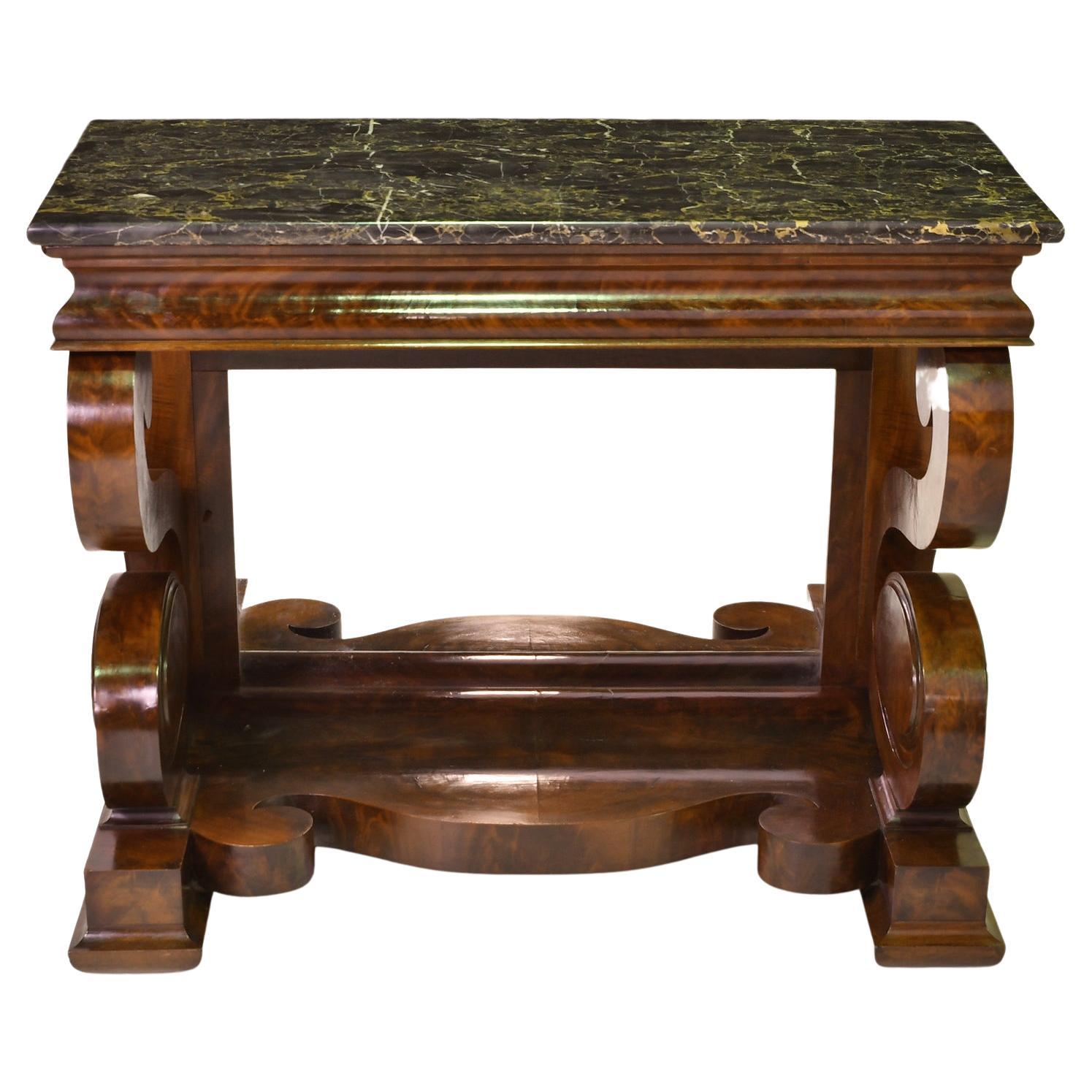 Attributable to the New York cabinetmaker, Joseph Meeks & Sons, a very beautiful American Empire console or pier table in the Grecian style in fine West Indies mahogany with Italian black, nero portoro marble top that has white & some warm gold