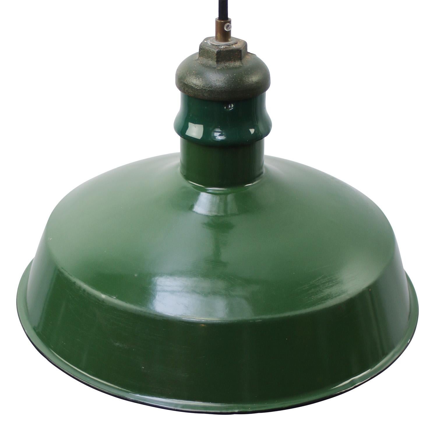 Vintage American green enamel industrial pendant lamp
Cast iron top, white interior

Weight: 1.60 kg / 3.5 lb

Priced per individual item. All lamps have been made suitable by international standards for incandescent light bulbs, energy-efficient