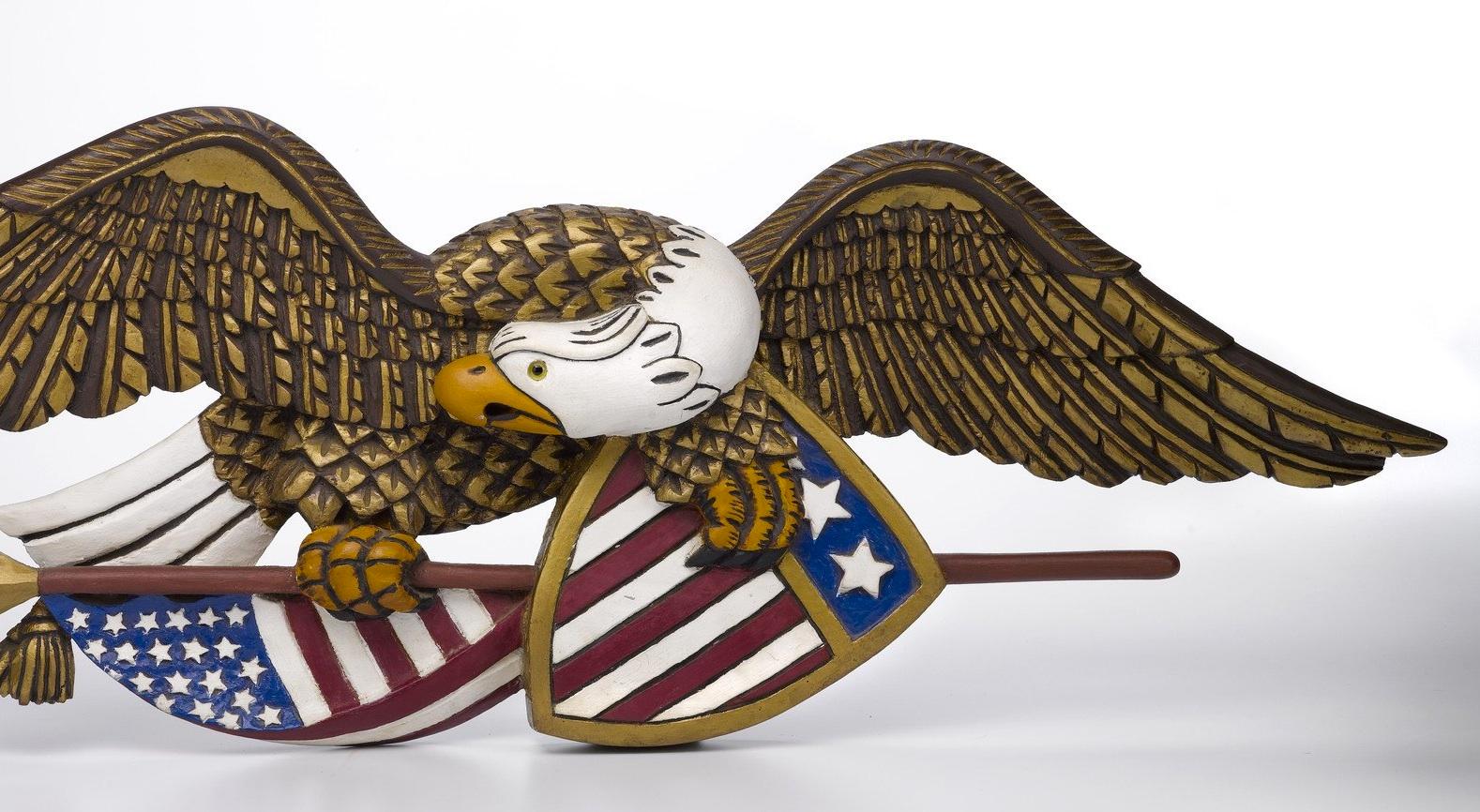 american eagle holding arrows