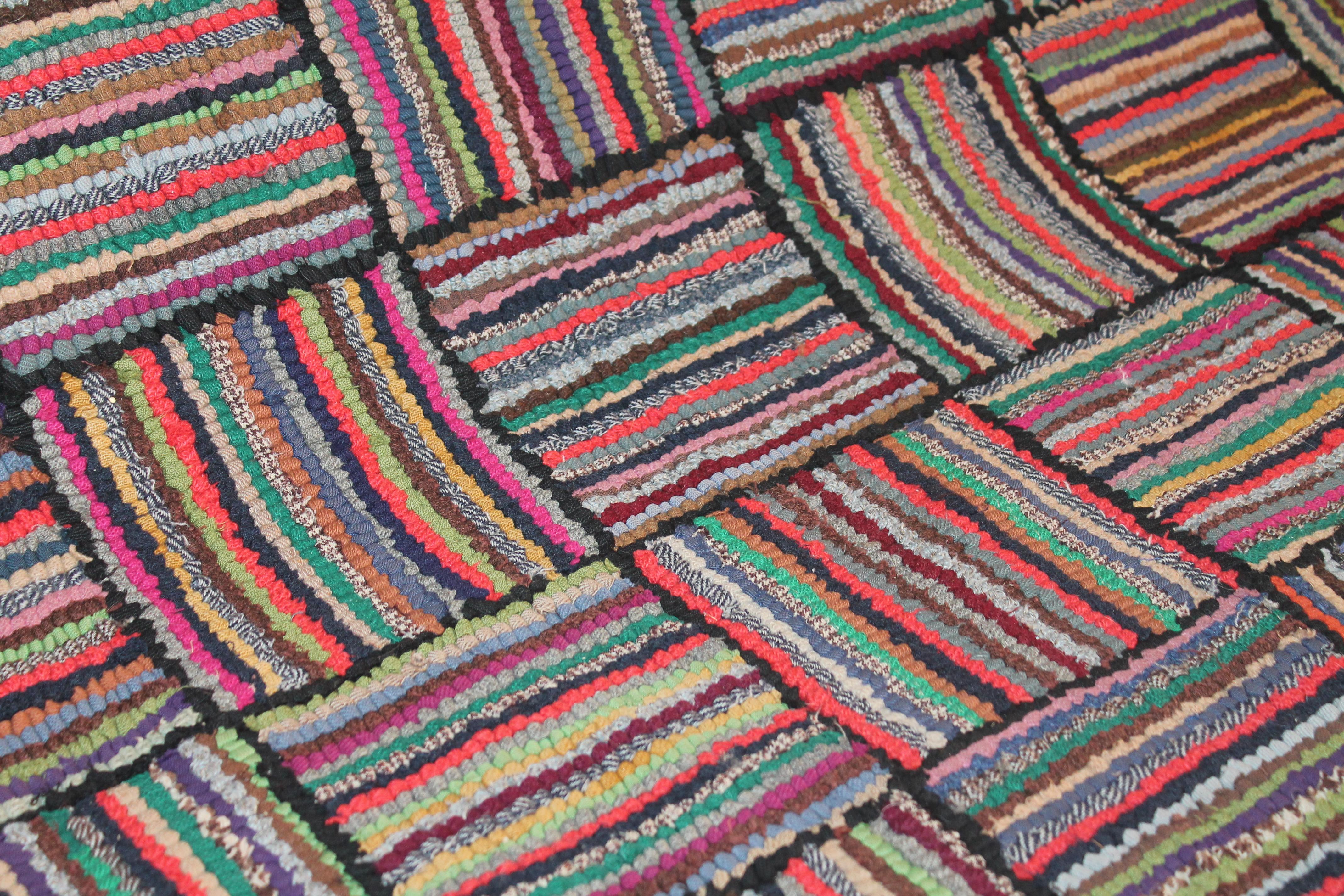 This large four foot wide American hand hooked runner rug is in pristine condition and is twelve foot four inches long. The colors and condition are fantastic.