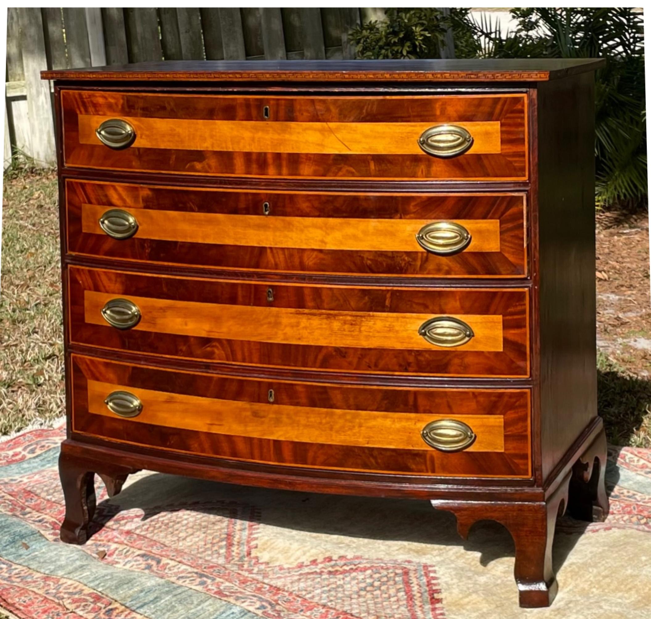 American Hepplewhite Bow Front Chest of Drawers with Satinwood Banding

This handsome chest features wide satinwood banding on the four bowed drawer fronts. The piece is all original and dates to the early 19th Century. Slightly flaring French