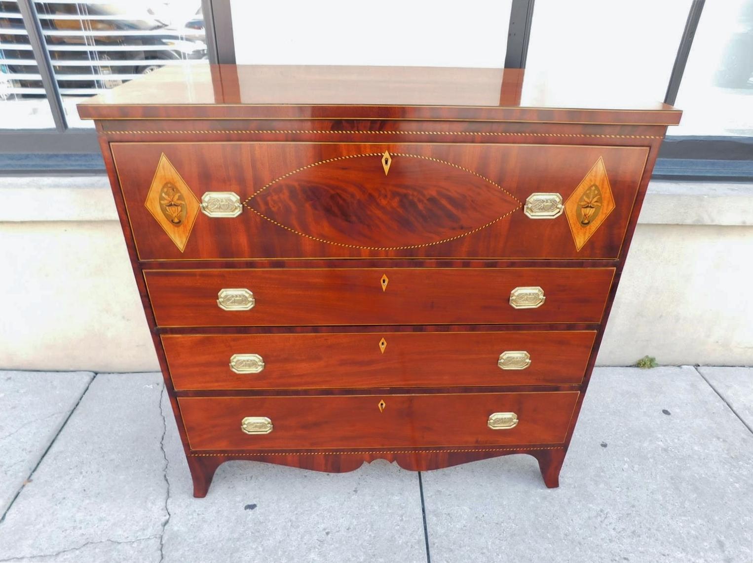 American Hepplewhite mahogany four graduated chest of drawers with a carved molded edge satinwood string inlaid top, flanking diamond urn foliage inlays, checkered string and oval inlays, ebony inlays, central diamond inlaid keyhole escutcheons,