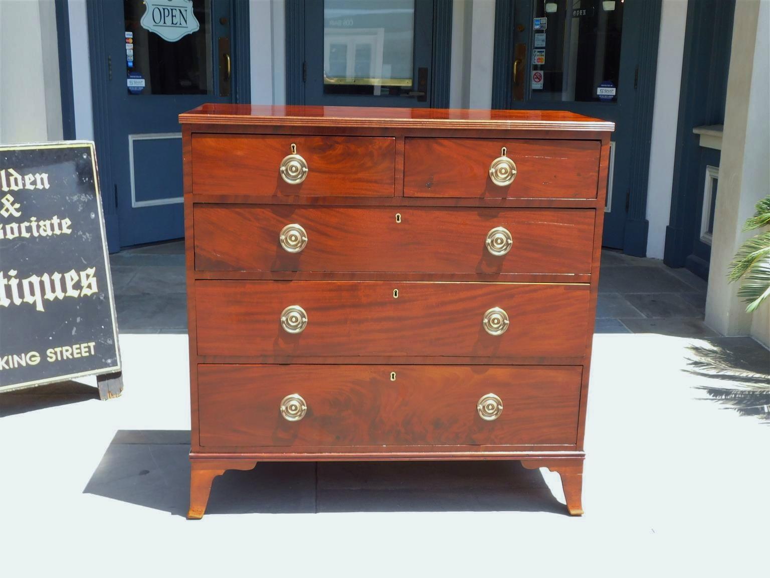 American Hepplewhite Mahogany chest of drawers with a reeded molded edge top, five graduated drawers with circular brasses, and resting on the original french splayed feet, Late 18th Century. Secondary wood consist of white pine and tulip poplar.