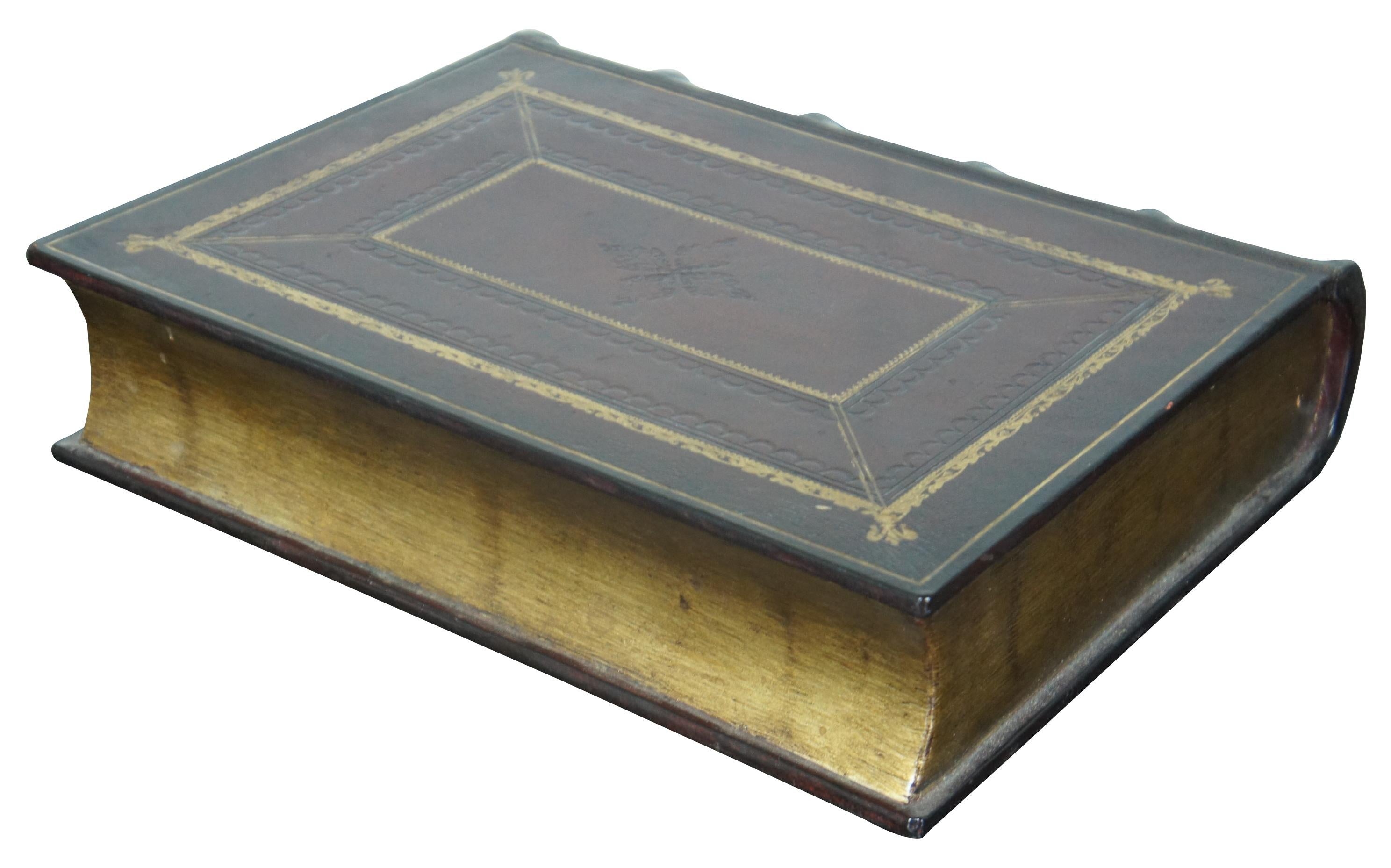 Faux book shaped trinket box finished in oxblood red tooled leather with gold accents and page edges; titled “American History.” attributed to Maitland Smith.
 