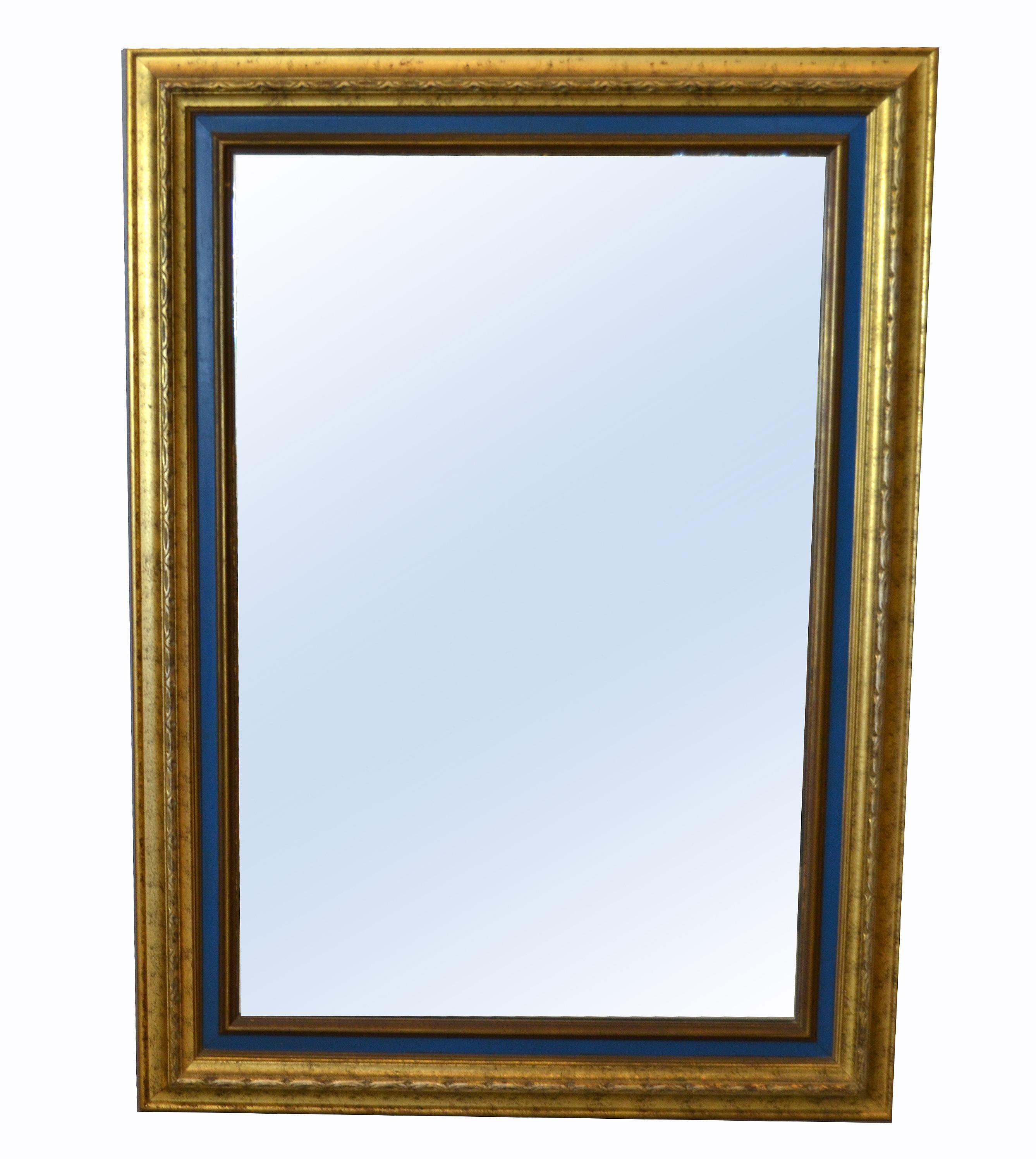 American Hollywood Regency rectangular antique gold finished and blue wooden wall mirror. 
This mirror is made out of carved wood and is very heavy.
It can be hung horizontal. 
Mirror size: 23 x 35 inches.
 