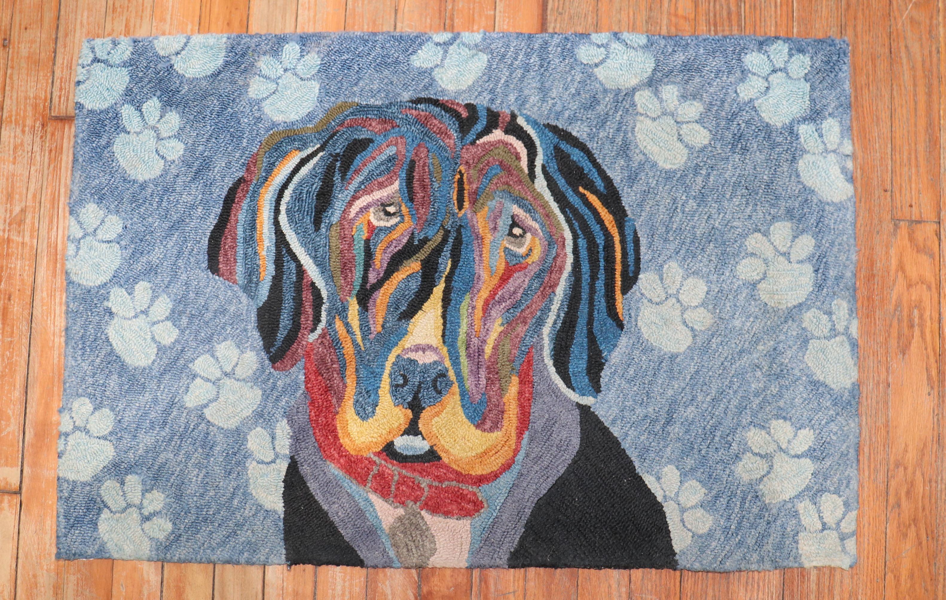 Late 20th century hand-loomed American hooked rug depicting an innocent dog.

Measures: 2' x 2'11''.