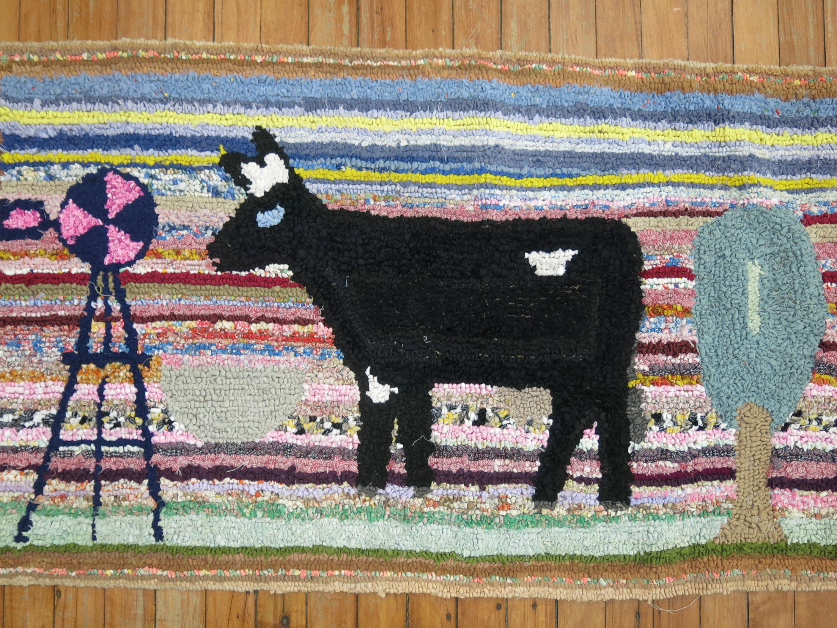 A handmade American hooked rug from the early part of the 20th century depicting a black cow. Condition is really nice. No stains, no tears, has been professionally cleaned. Backed with blue fabric.