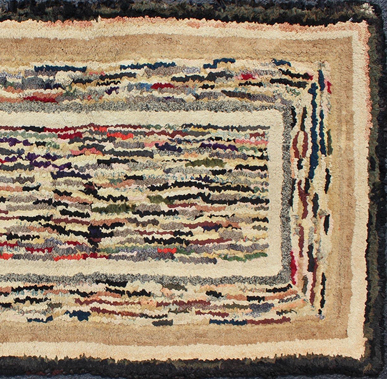 Antique hooked rug with variegated design, Keivan Woven Arts , rug J10-1017, country of origin / type: United States / Hooked, circa 1920.

This antique rug features a variegated stripe design. The rug was woven in a hooked fashion, and the