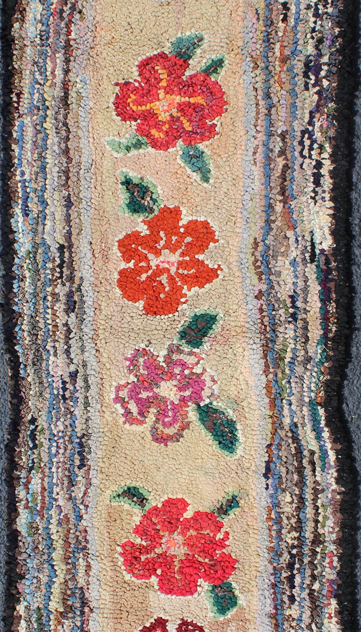 American Hooked runner with colorful vertical medallion design, Keivan Woven Arts / rug L11-1210, country of origin / type: United States / hooked, circa 1920.

This American Hooked rug depicts a beautiful design of vertically-arranged floral