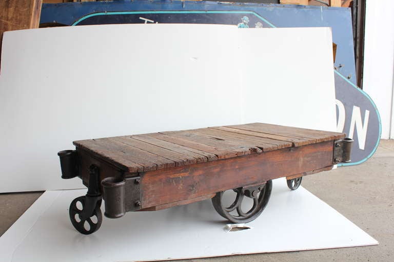 Vintage American industrial cart/coffee table. Newly refinished. We have over 20 carts available.