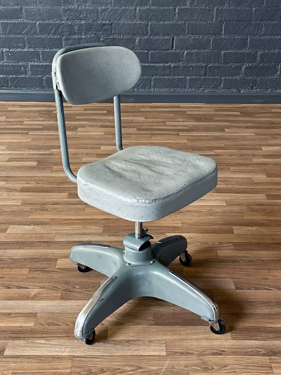 Condition: Original Vintage Condition
Designer: Hamilton Mfg Co.  
Manufacturer: Hamilton Mfg Co.
Materials: Steel, Original Vinyl Upholstery 
Style: American Industrial 

Dimensions: 
30” -33.50