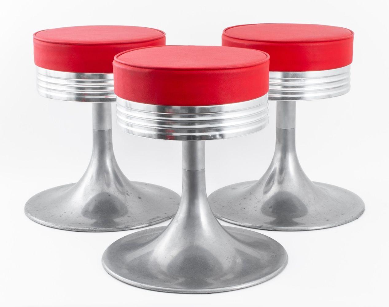 Set of Three American Industrial Modern Aluminum Stools, the seats upholstered in red faux leather, in the Art Deco taste. 18