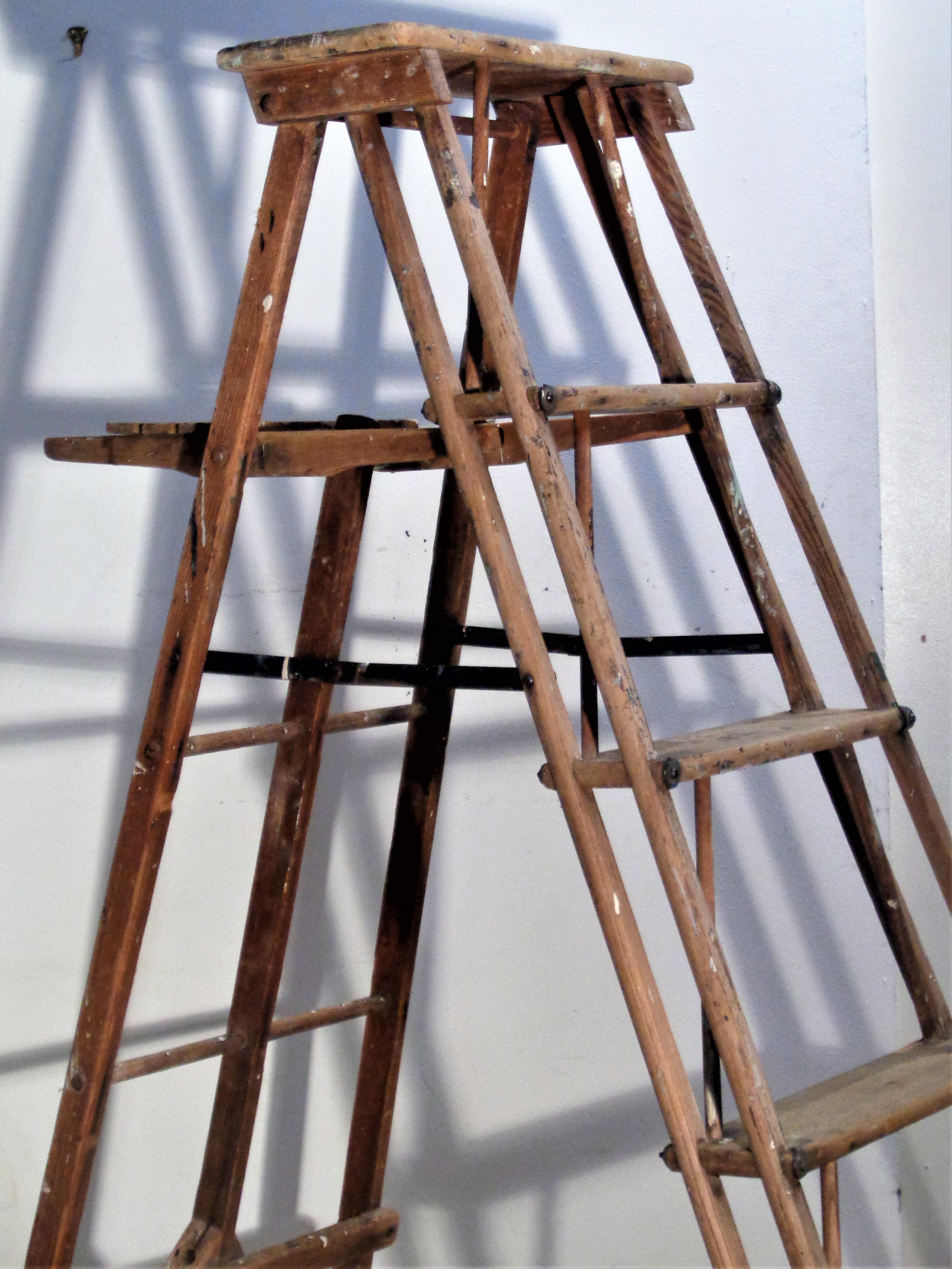 American Industrial painter's / utility work ladder with beautifully designed architectonic form and great old color to wood and metal construction. In fully open working position as shown in pictures - measures 56