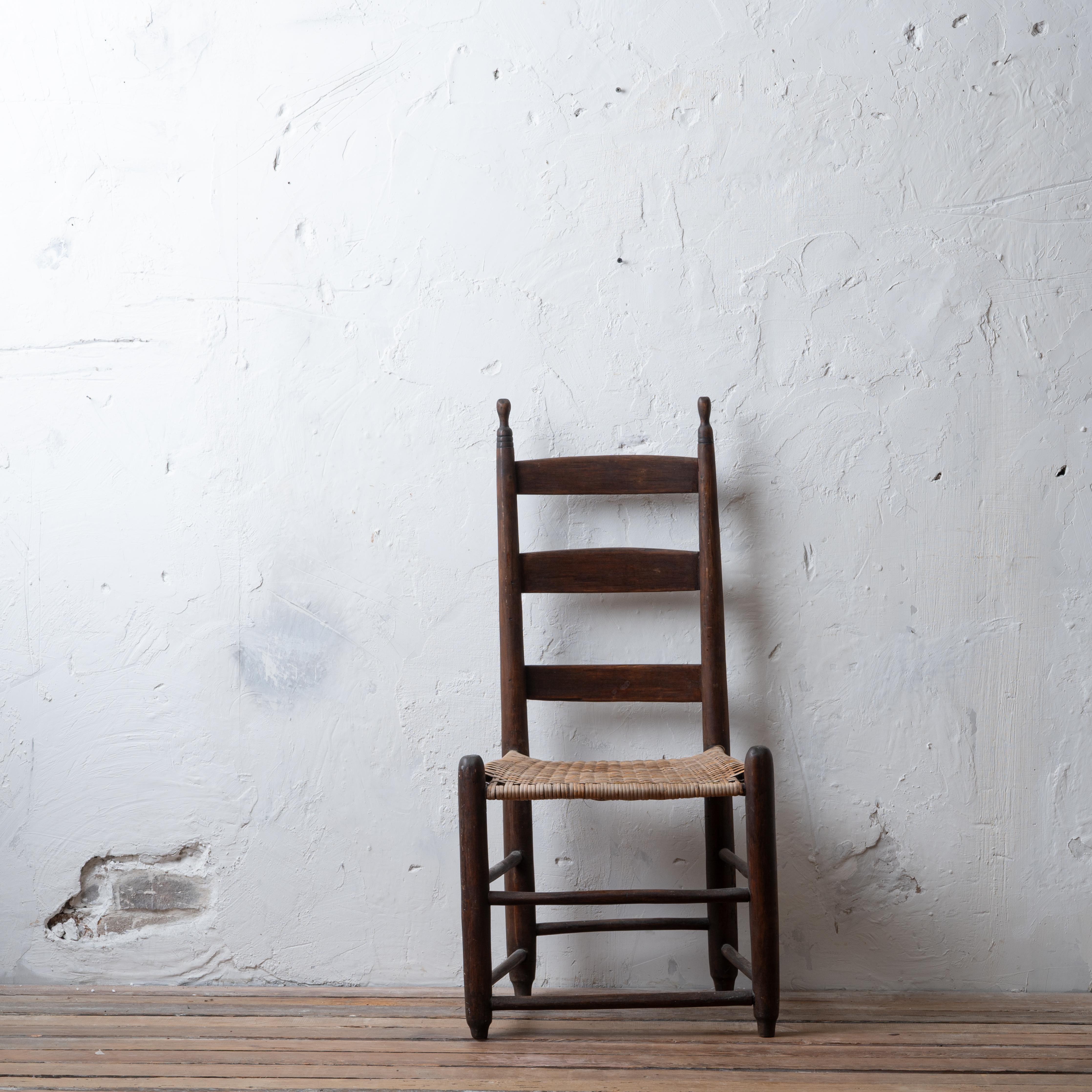 An American three slat ladder back chair with cane seat, circa 1800.

18 ¾ inches wide by 14 ¾ inches deep by 38 ¼ inches tall; seat height 15 ¼ inches


