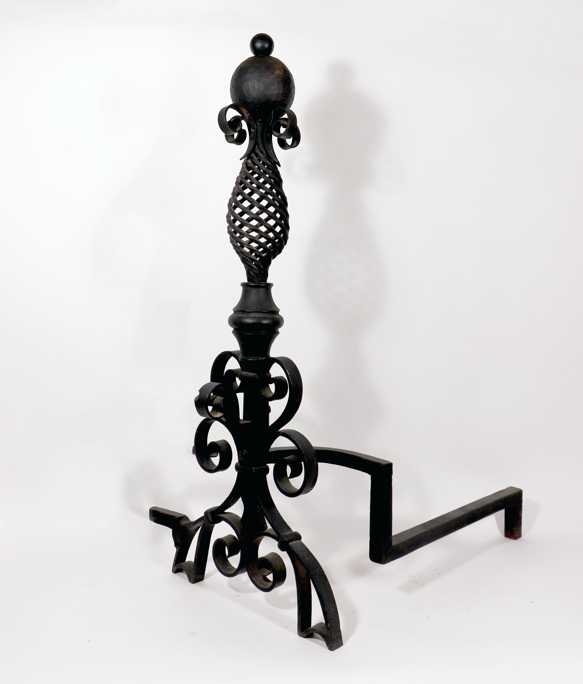 Large American Arts & Crafts pair of wrought-iron Andirons,
Circa 1890-1910

Ready for your castle!.

The particularly large and striking black Arts & Craft period hand wrought iron forged andirons with black pigmentation have spiral pineapple