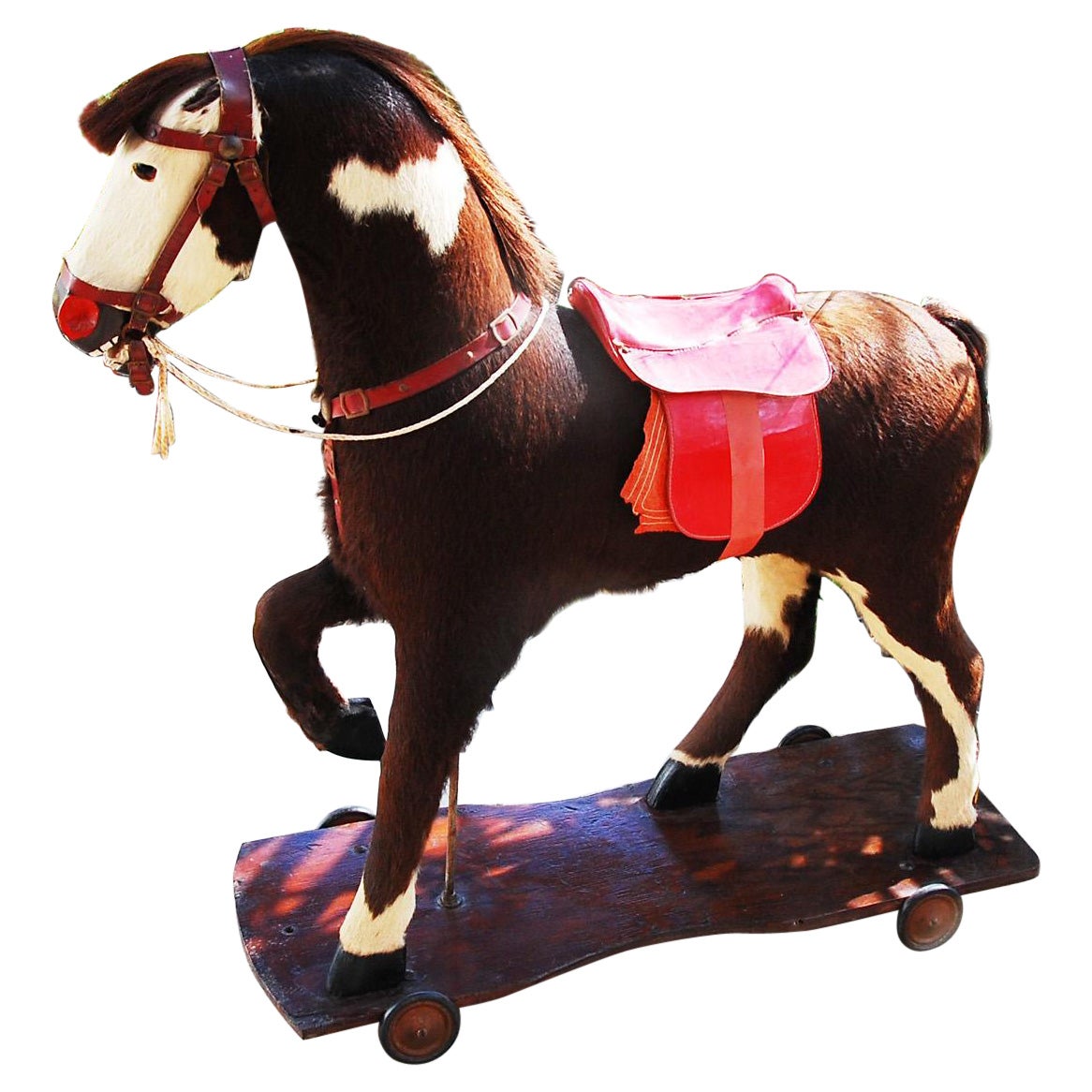 American Large Pony Pull Toy Carved Wood, Horsehair Hide and Saddle Circa 1900 For Sale