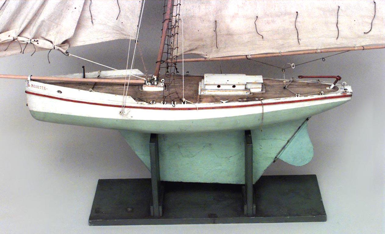 American large wood model of sail boat with green base and green and white hull. (19th-20th century).