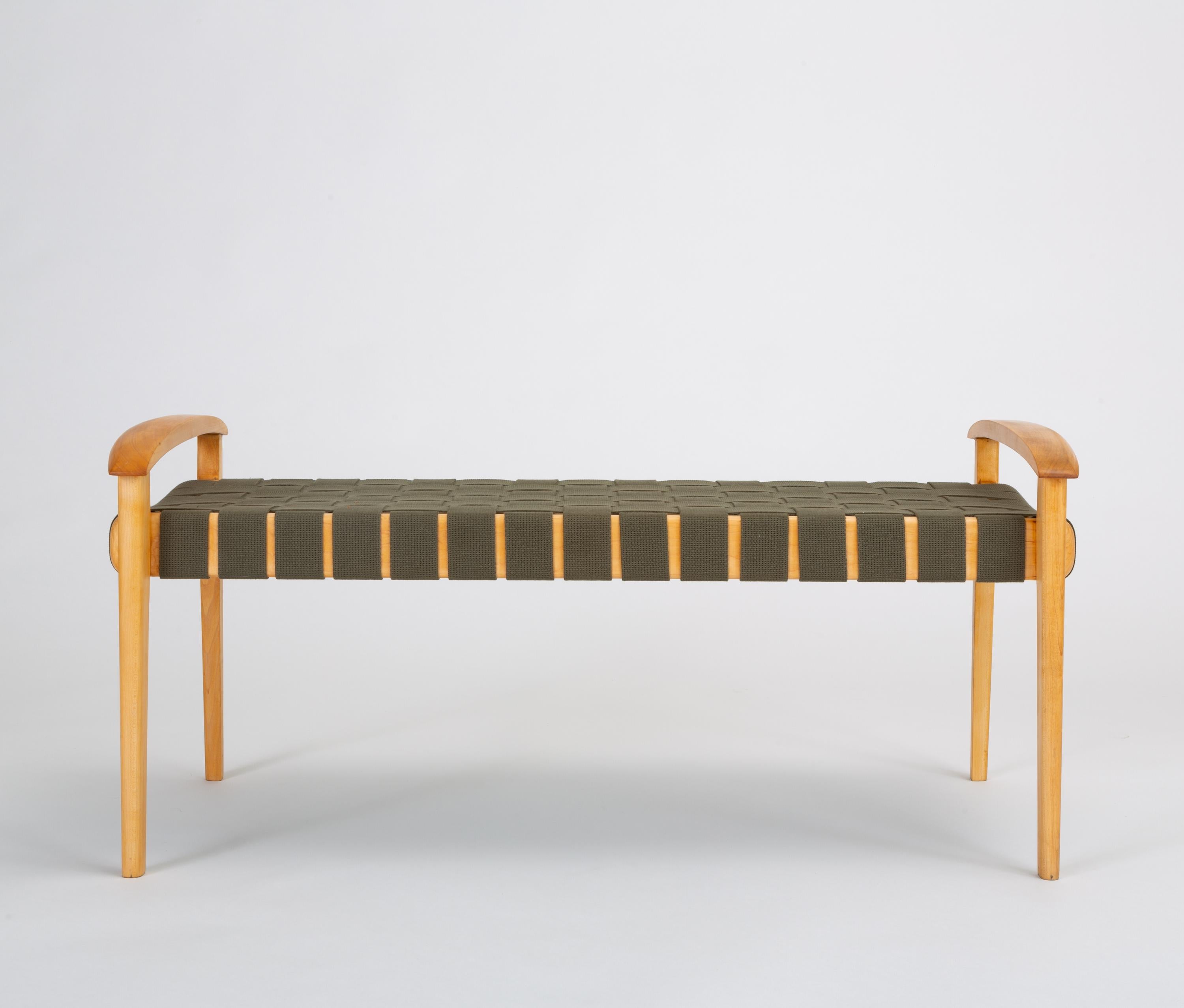 An elegantly crafted bench by Portland, OR-based furniture designer and fabricator. Ghilarducci is a contemporary designer, though this is an older design dating, according to a handwritten notation beneath the bench seat, to 2001. The Scandinavian