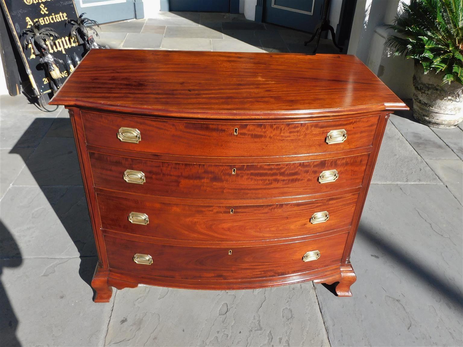 American Mahogany bow front chest with a carved molded edge top, four graduated drawers with the original brasses and escutcheons, flanking fluted quarter columns, and resting on the original ogee bracket feet, Mid-19th century
Secondary wood