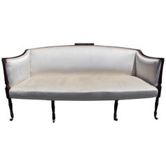 American Mahogany Sheraton Style Upholstered Sofa on Brass Casters. Circa 1880
