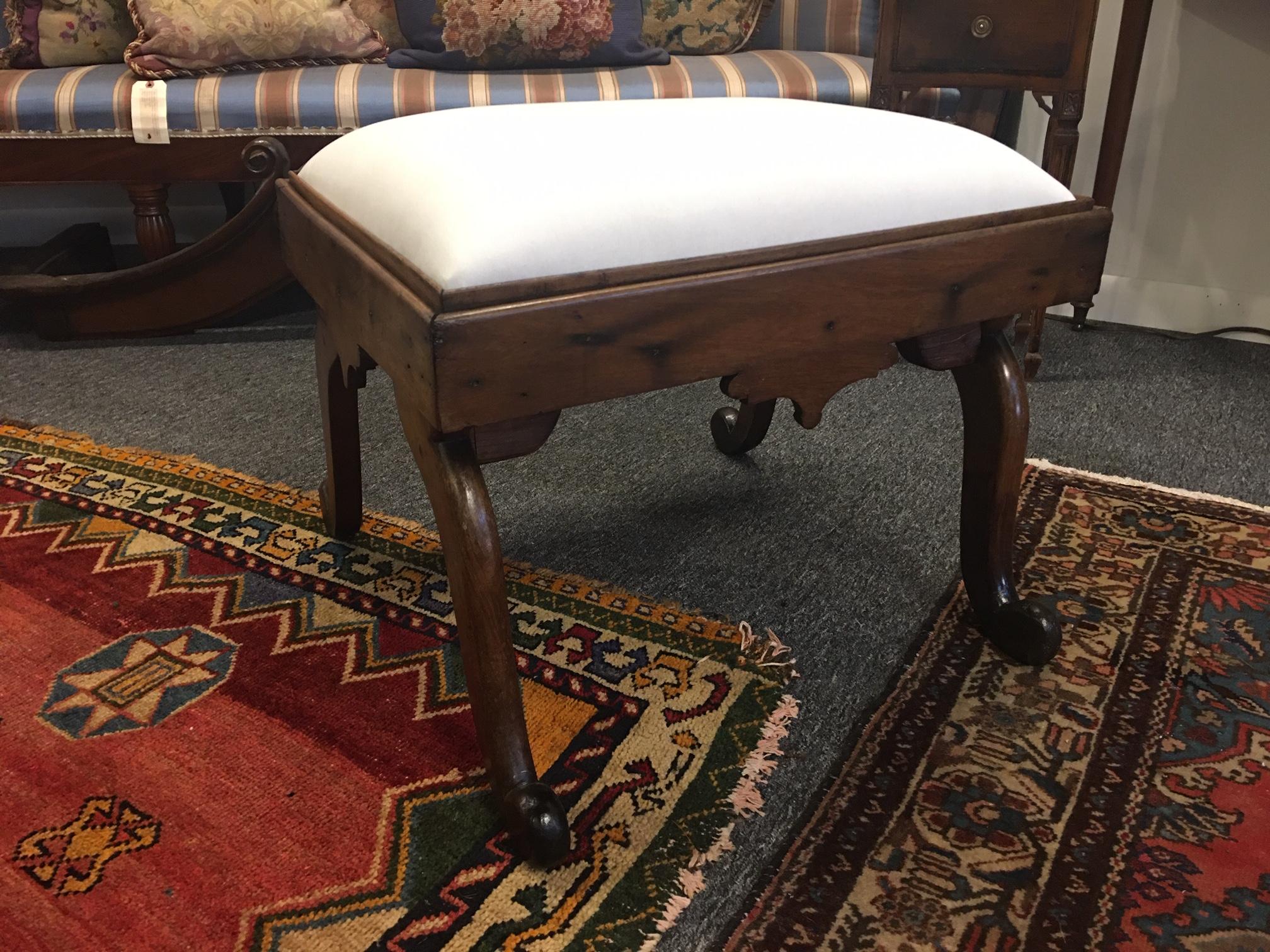 American mahogany stool or bench with decorative carved design, 19th century. Newly upholstered in Muslin.