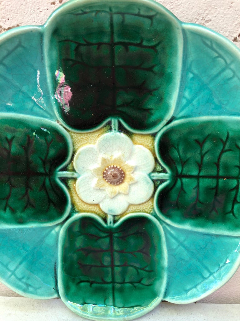 American Majolica Water Lily Plate signed Etruscan Majolica Circa 1890.
Unusual colors.