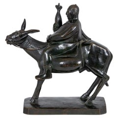 Bronce patinado americano "Hombre montado en burro