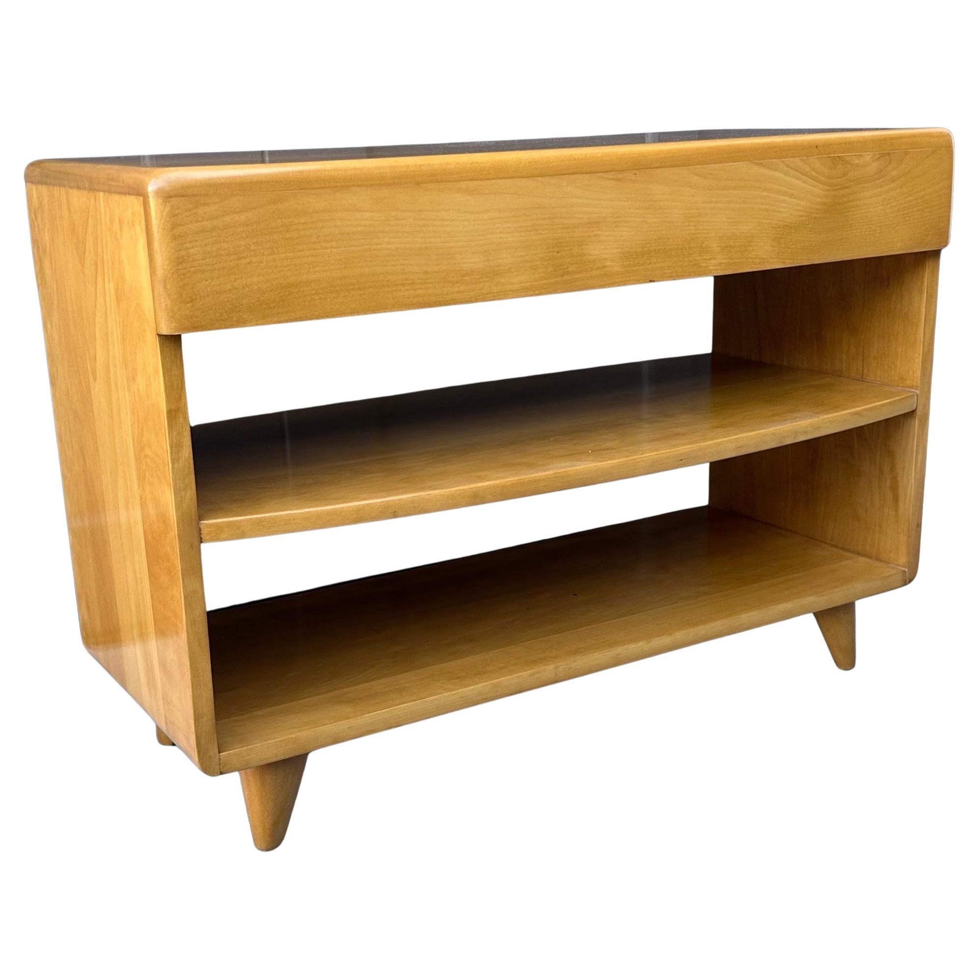 Super rare American MCM bookcase / end table with drawer by Heywood Wakefield, circa 1950s.  This piece is very hard to find and in amazing original condition with honey finish.  The end table measures 32