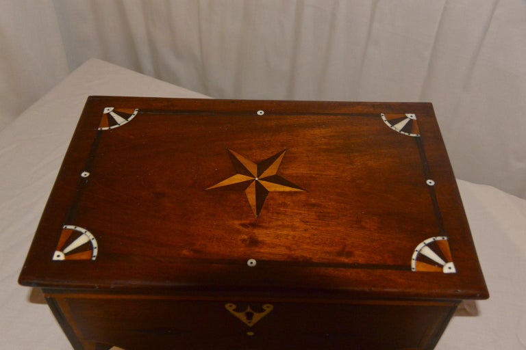 American Sailor made mid-19th century valuables box. This unique mahogany box is both sophisticated and naive as it is a work designed and executed by a sailor on a long sea voyage, not a standard work from a trained cabinetmaker. The ivory