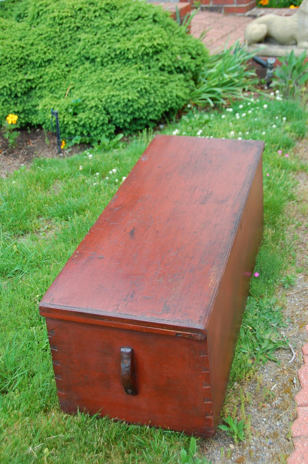 American mid 19th century six board seaman's chest with interior till, molded top, dovetailed construction and original red finish. The becket holders have been repaired and the rope beckets have not survived. This classic American piece of naval