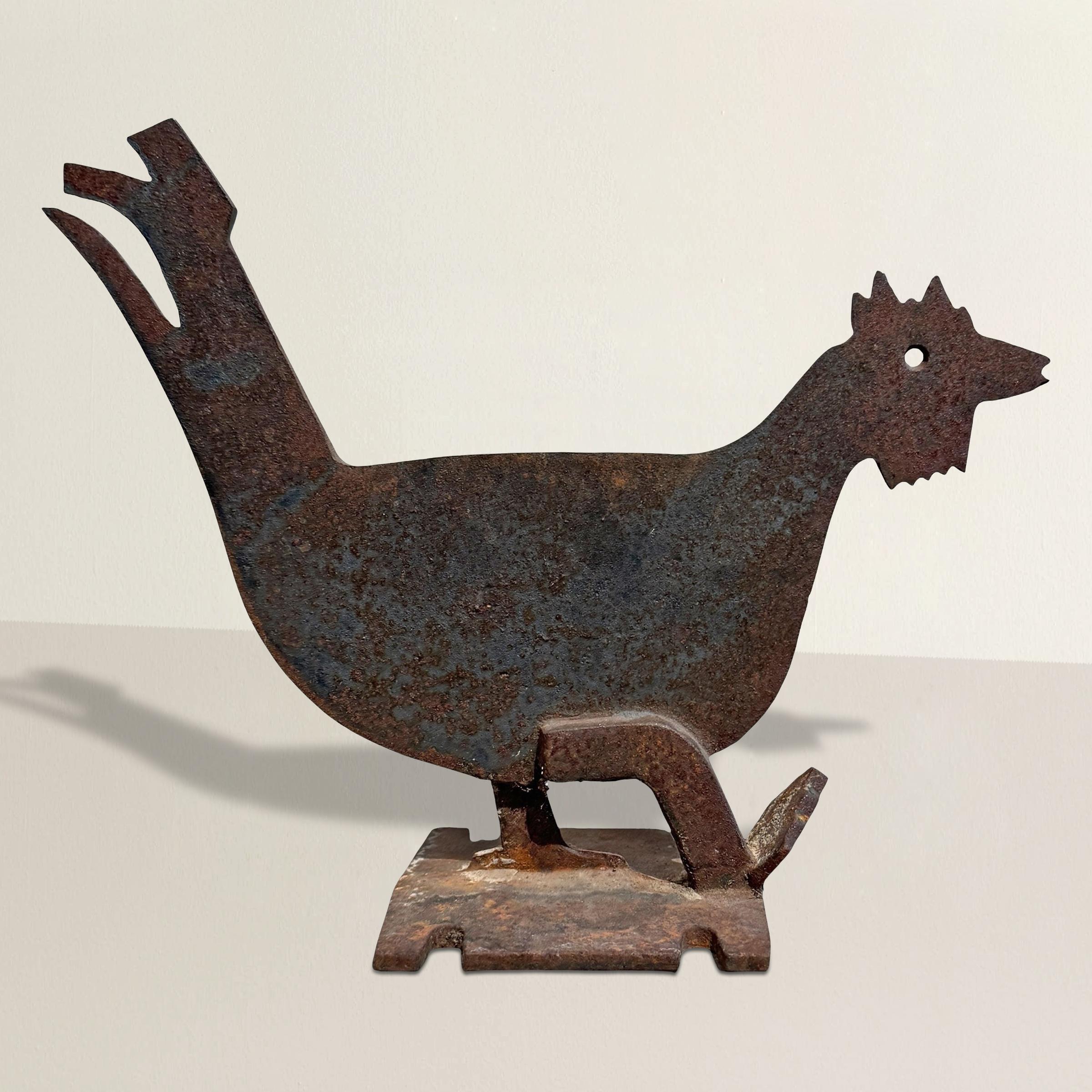 Full of charm and personality, this mid-20th century American iron bootscrape takes the form of a cheeky rooster—one foot lifted mid-strut, tail feathers slightly ruffled, and a knowing glint in his pierced eye. Crafted of solid iron and mounted to