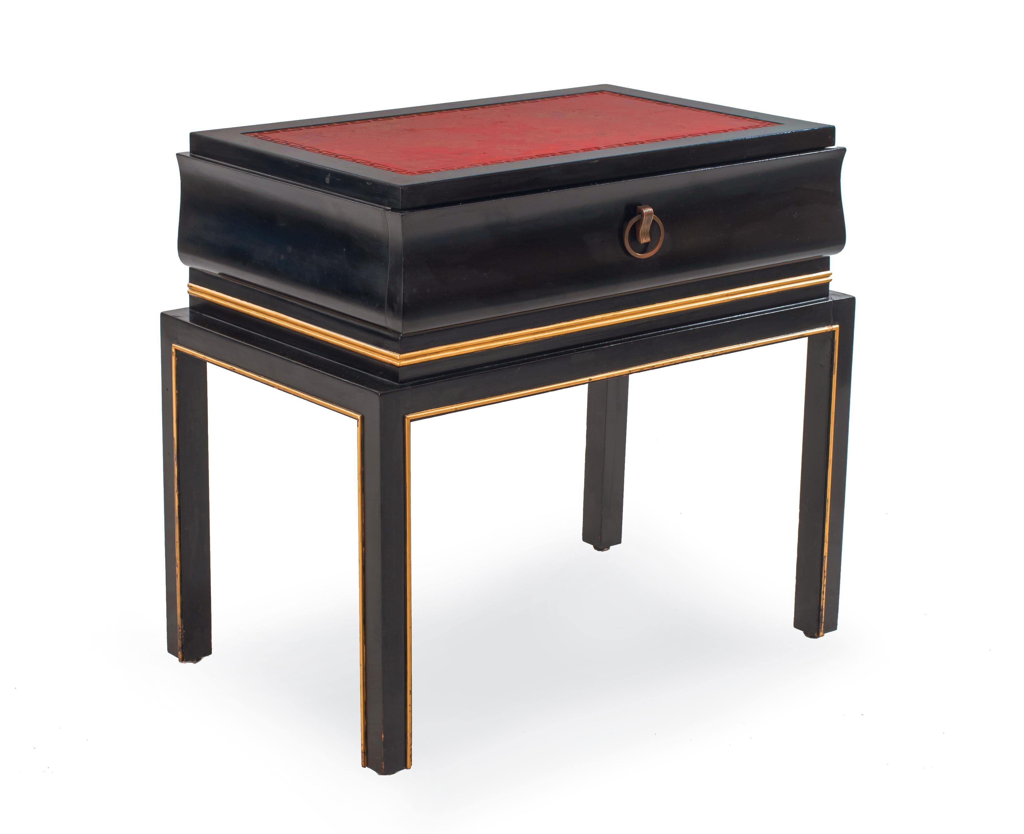 Pair of American midcentury black lacquered low end tables with a single drawer and gilt trim resting on 4 legs (attributed to Tommi Parzinger).