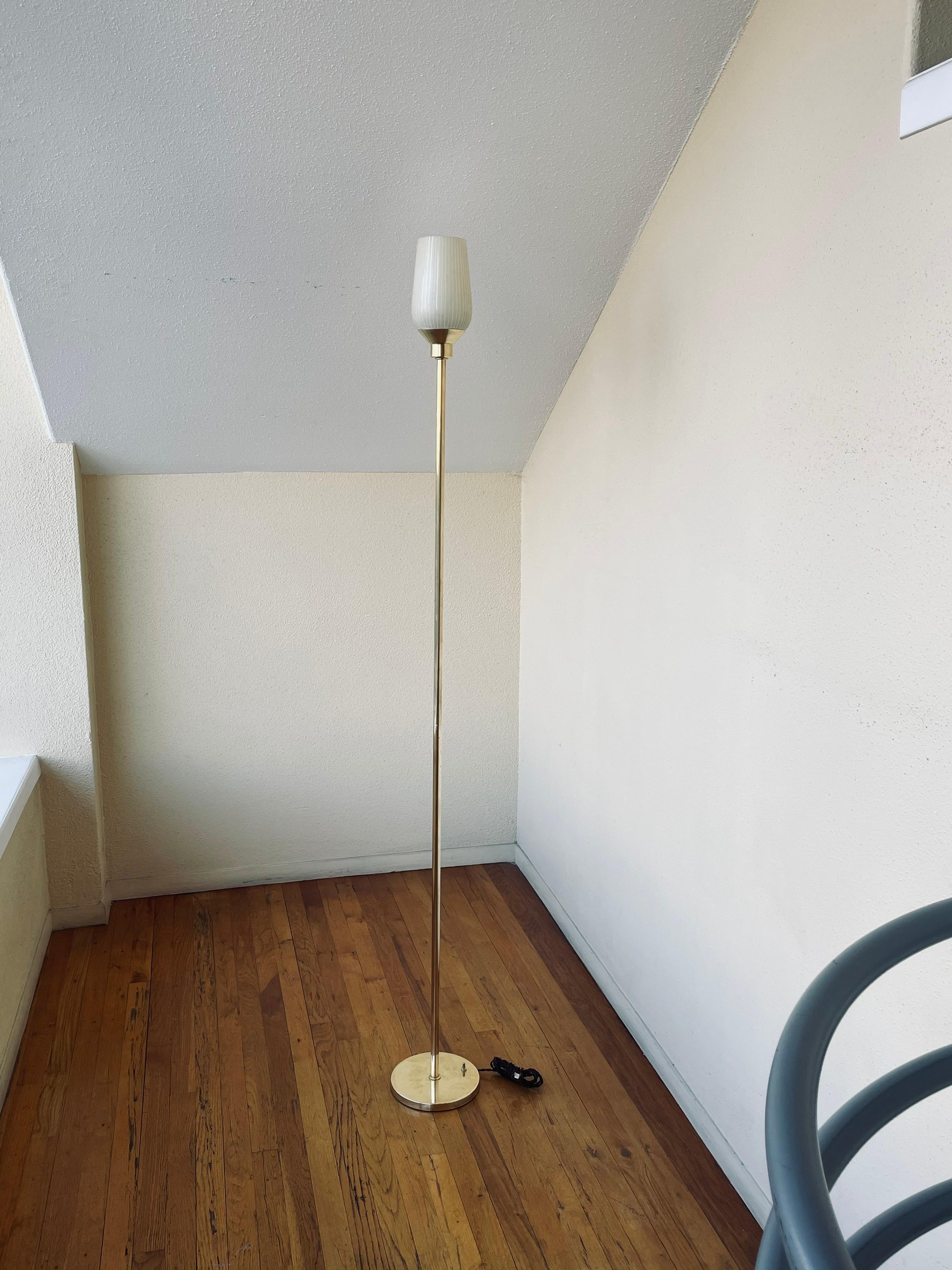 Elegant simple floor polished brass torchiere floor lamp, this lamp has been lightly polished leaving some natural patina, and rewired has a push-off/on switch at the bottom of the base with a cloth cord, a great accent lamp, Italian glass shade,
