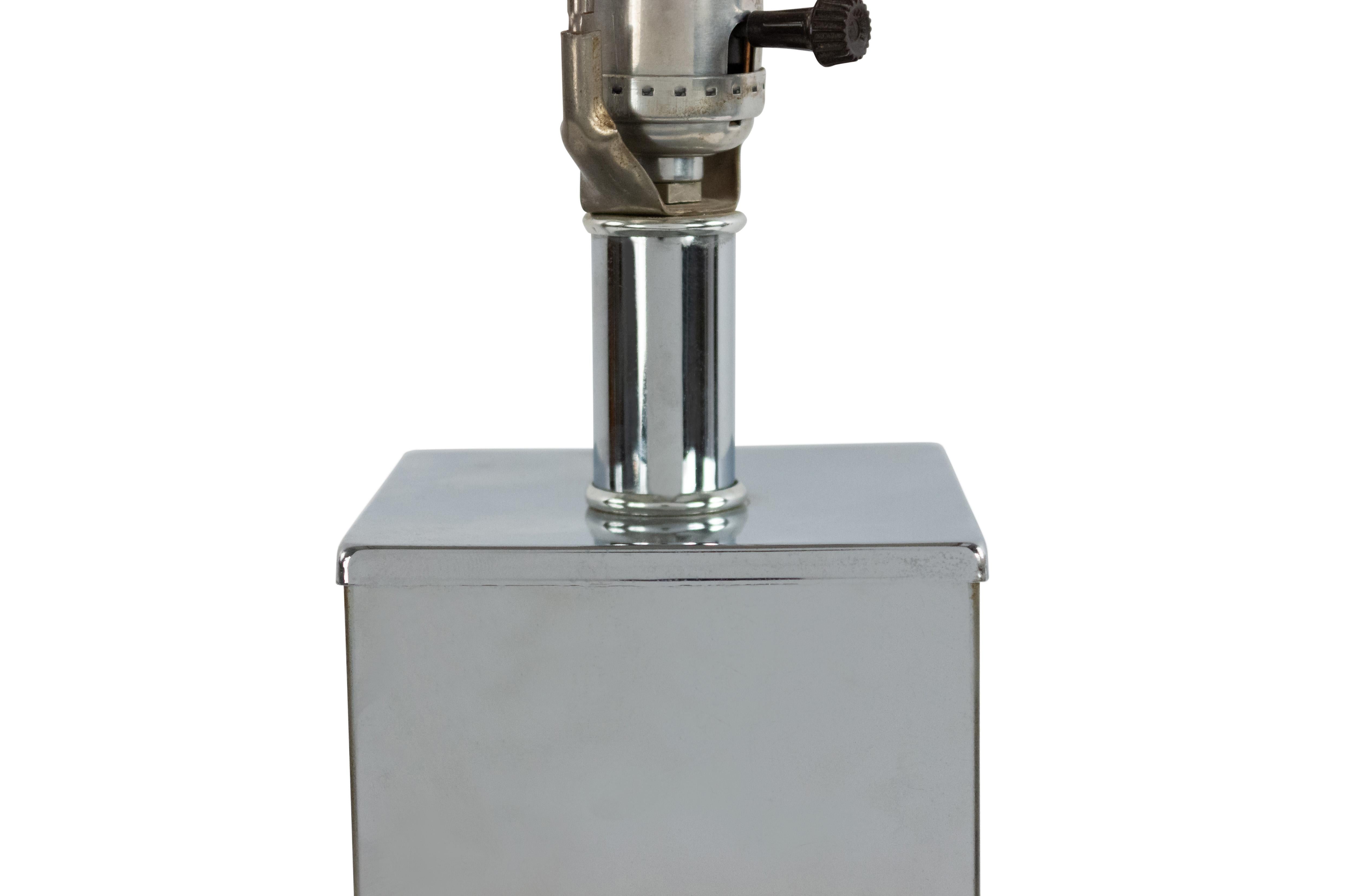 American midcentury chrome square table lamps resting on a square base.