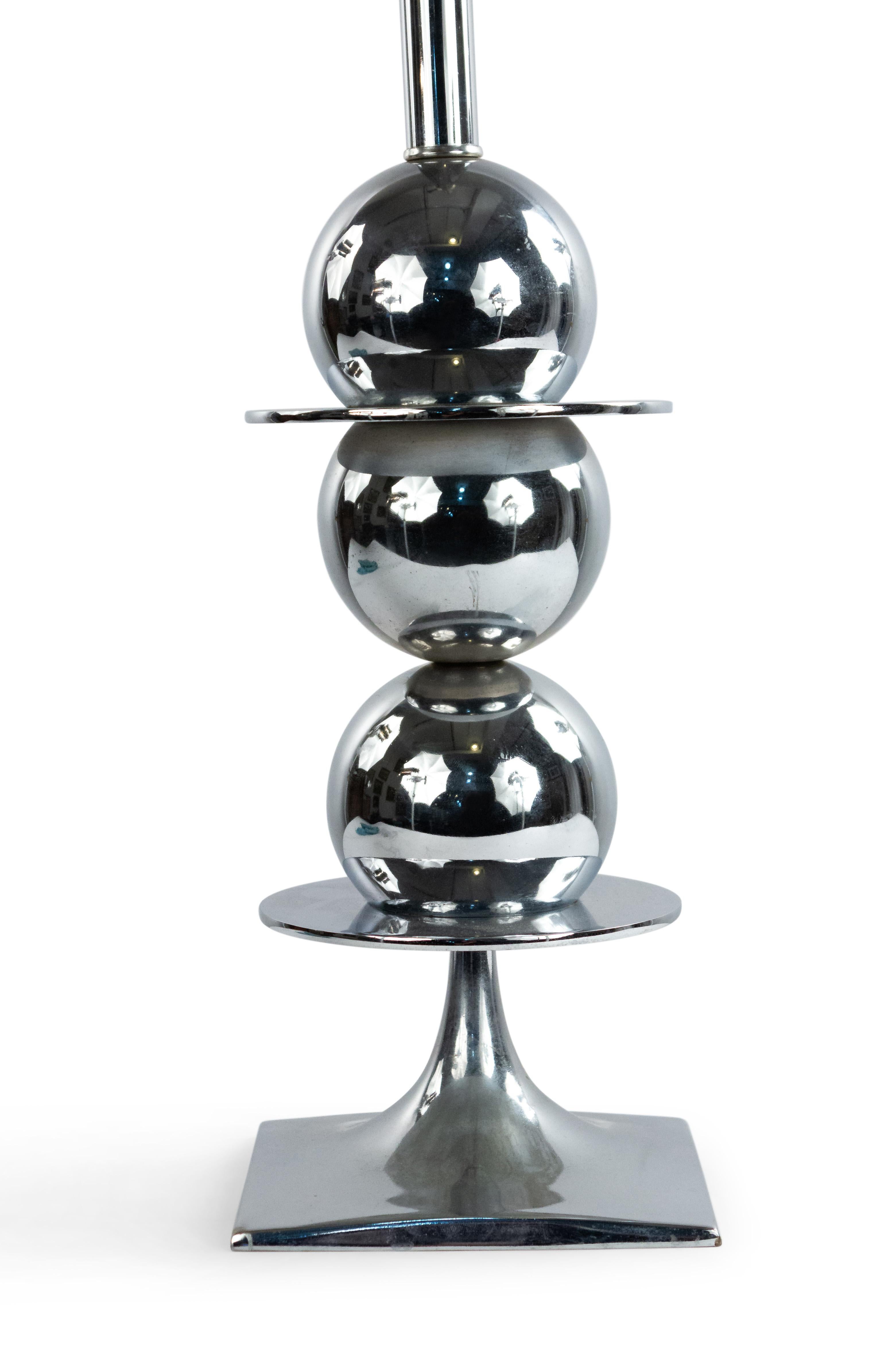 American midcentury chrome table lamp composed of discs and spheres on a square base.