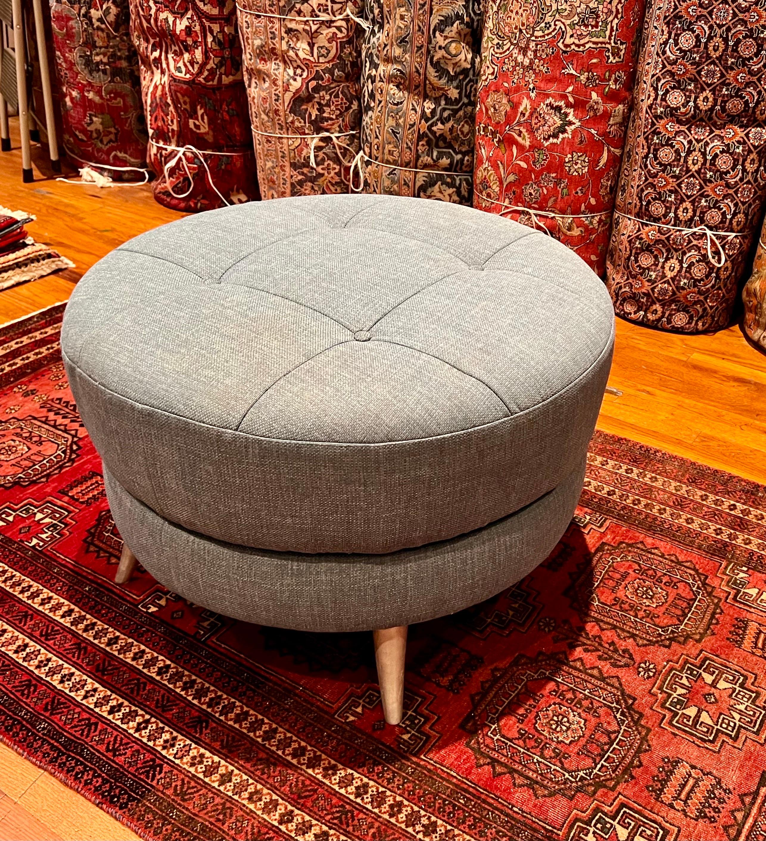 American Mid-Century Modern large swivel round ottoman with Horn style brushed steel legs nice and clean upholstery in light blue fabric by Knoll.
