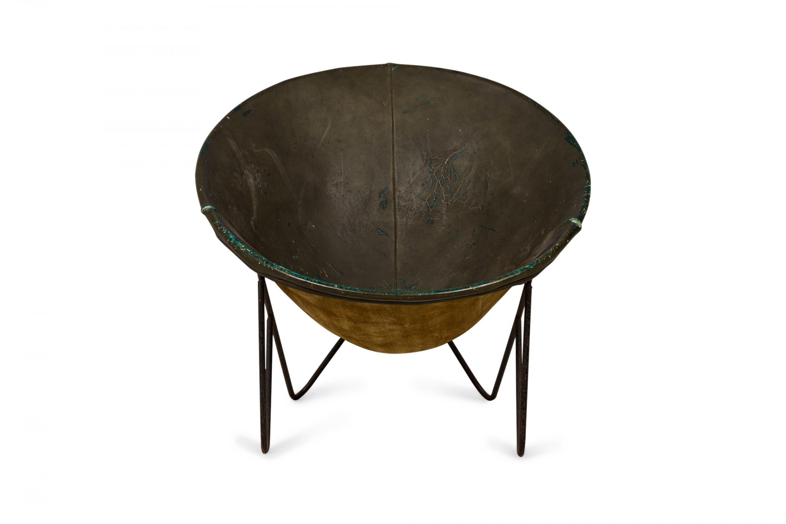 American Mid-Century hoop lounge chair with a dark green leather seat atop a black painted steel hairpin leg frame.
