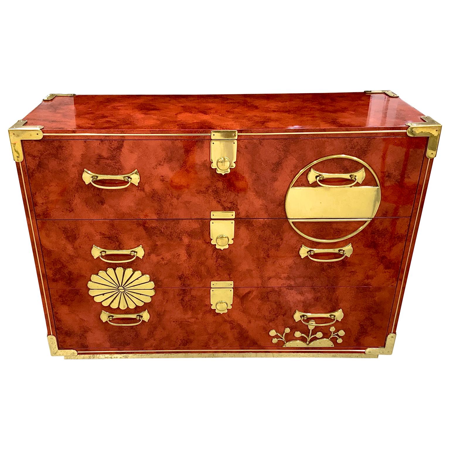 A exceptional Mastercraft Asian Mid-Century Modern brass chest. Wonderful solid brass hardware corner plates etc. the chest has a gorgeous hand faux lacquered original paint in a fabulous persimmon color. 