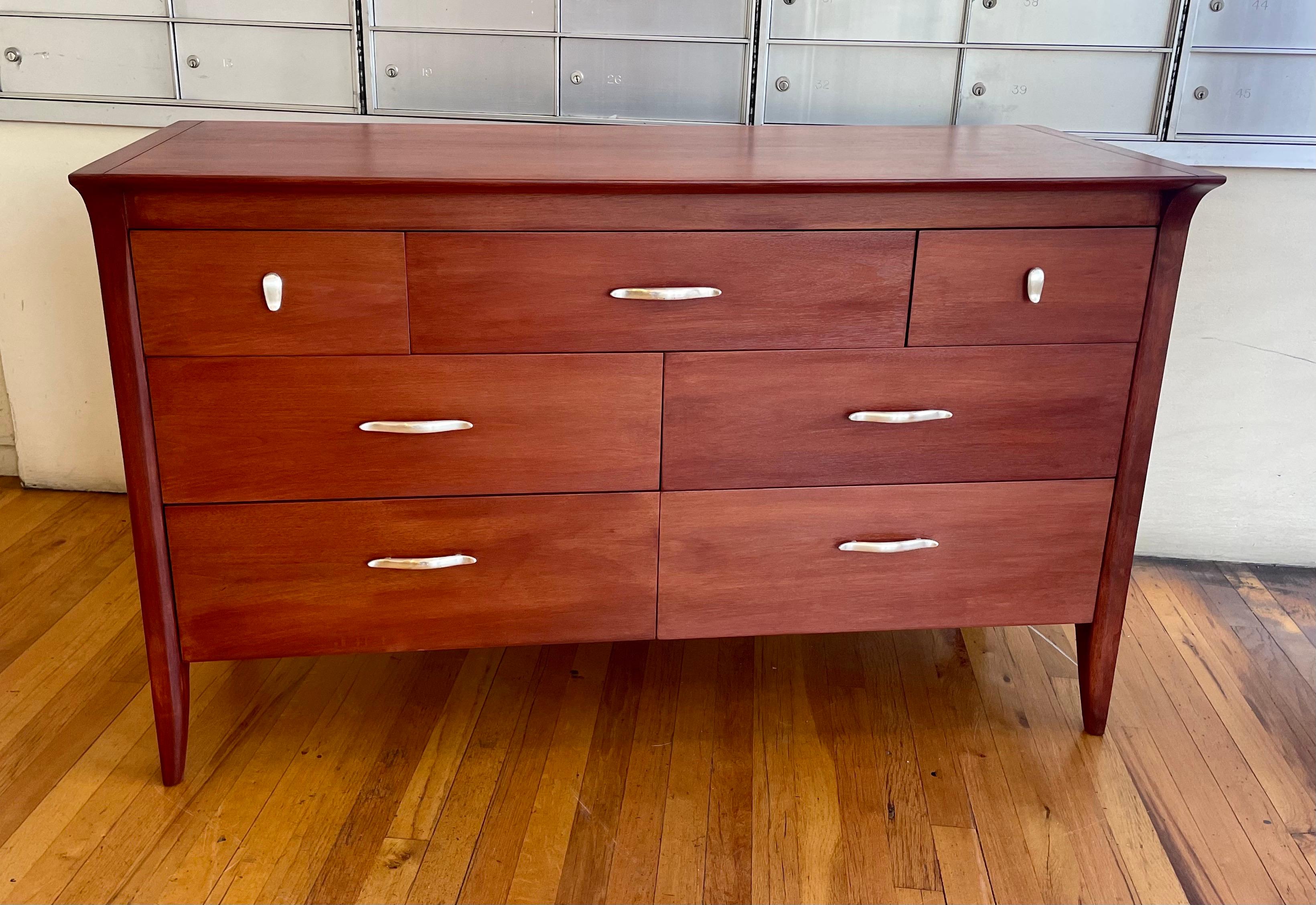Beautiful 7 drawer dresser by Drexel designed by John Van Koert, freshly refinished in a teak/cherry finish with silver-plated polished handles. very clean part of the Drexel Profile line.