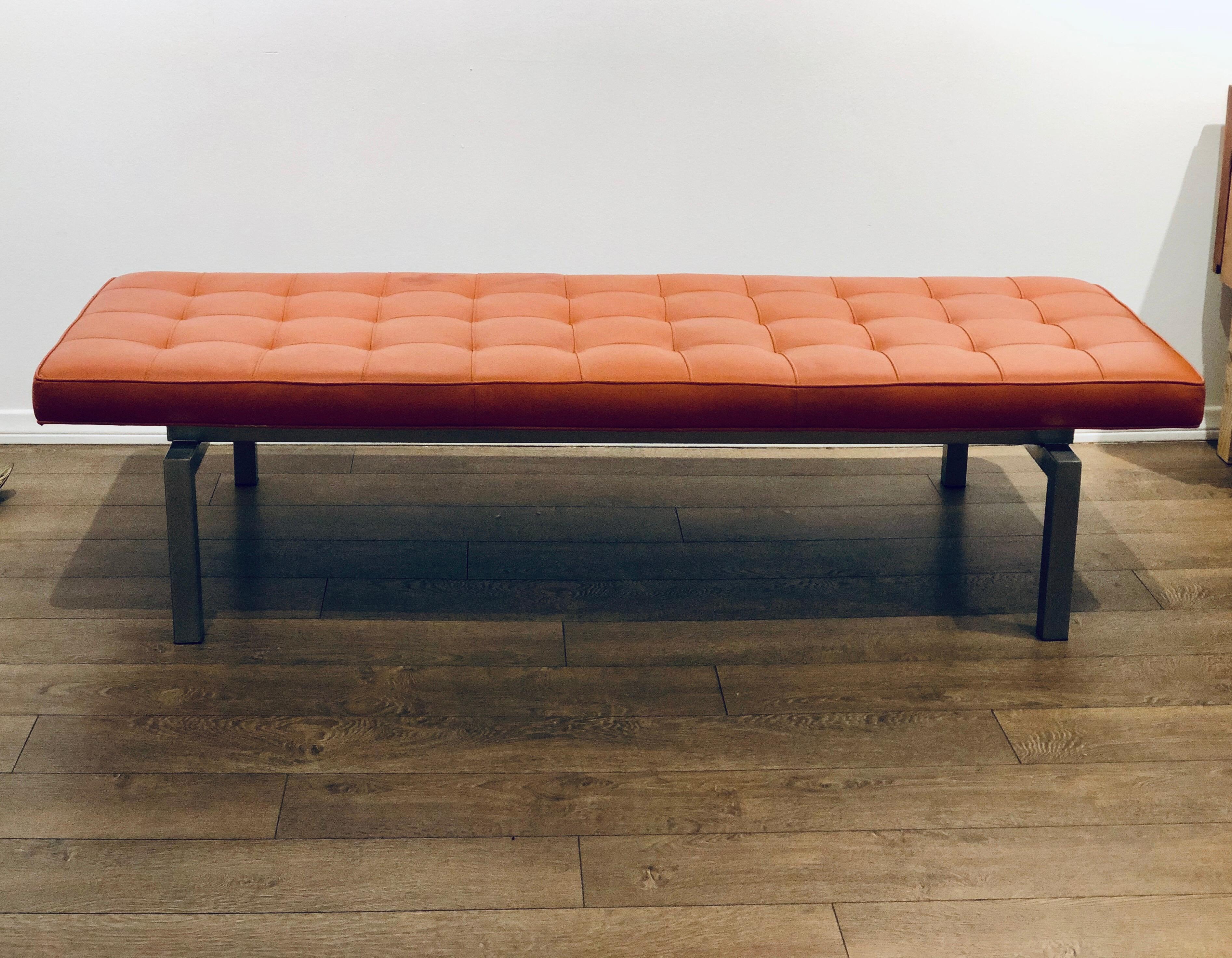 A very nice and comfy orange leather bench with brushed steel base frame, circa 1970s, nice solid sturdy frame nice color on the leather with a blemish stain or spot as shown on the picture, great quality sold AS/Is normal wear due to age.