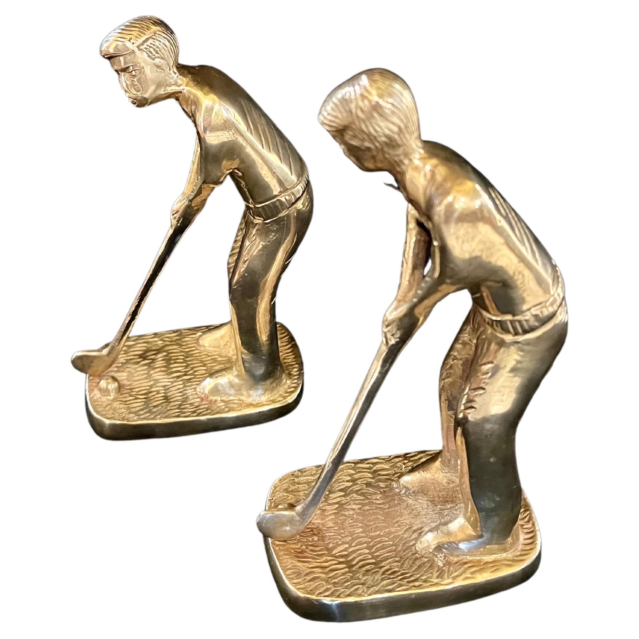 A nice pair of polished brass American Golfers bookends a nice patina.
