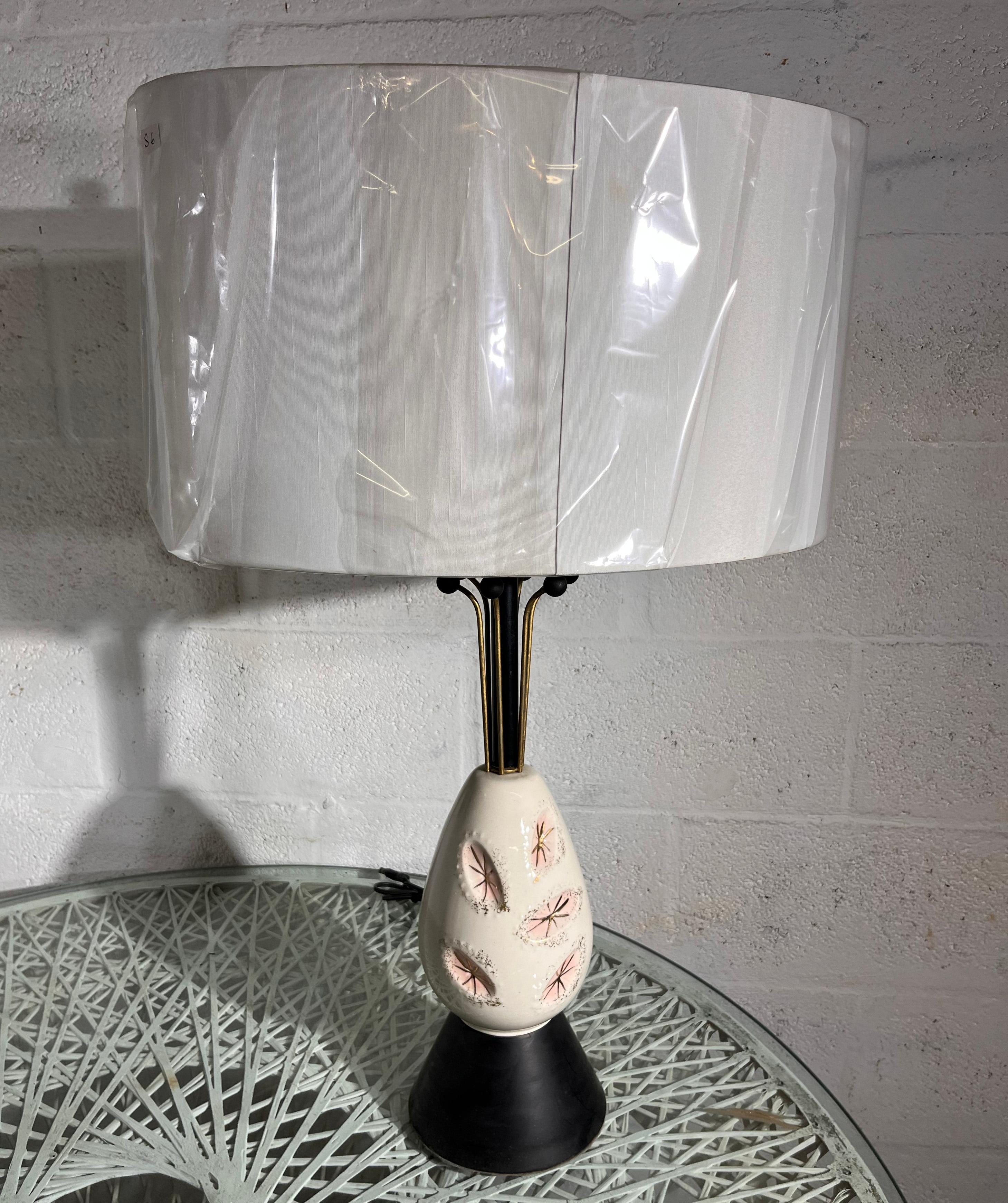 Mid-Century Modern pair of American ceramic table lamps. Typical from this period.