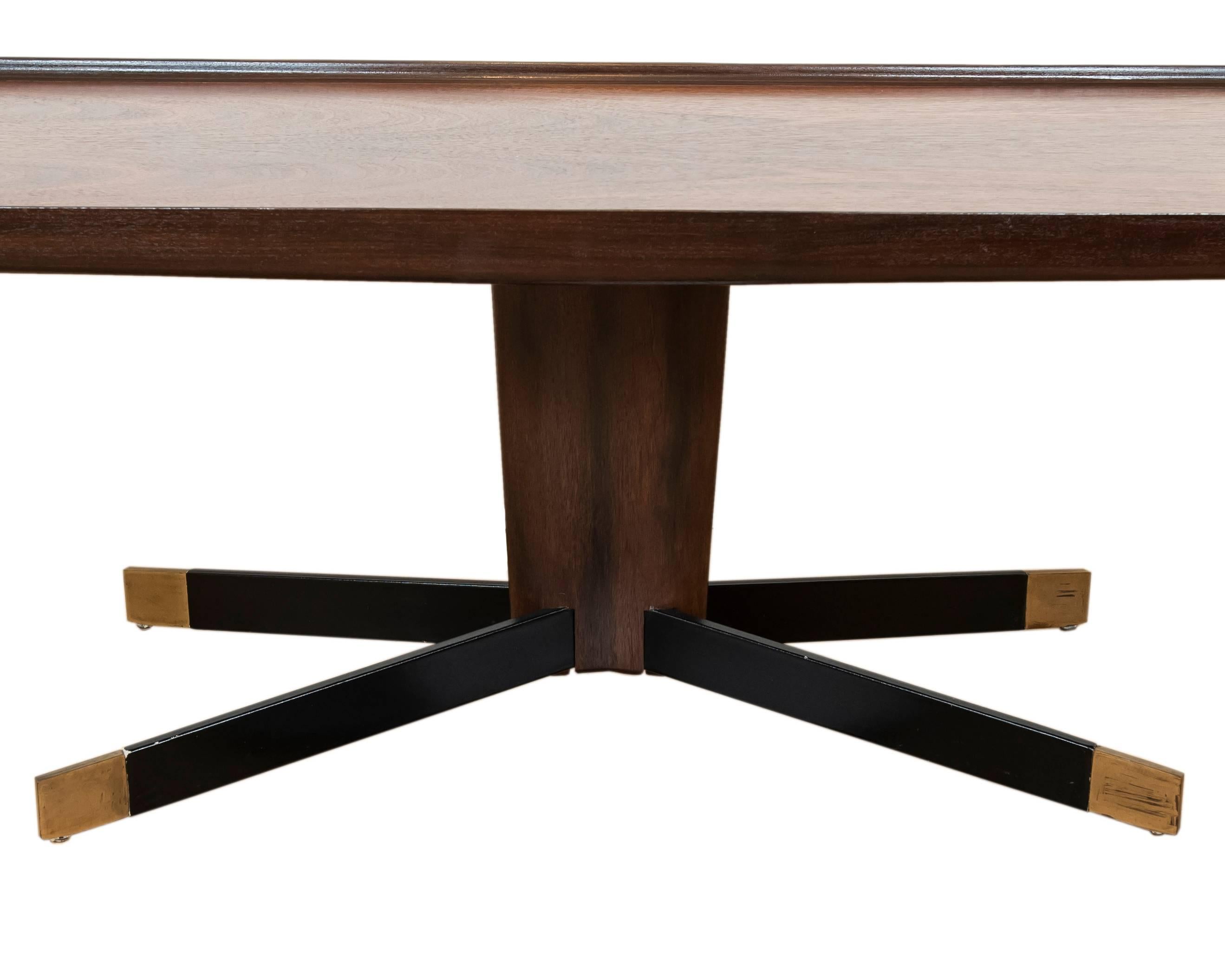 This unique and cool vintage wood coffee table with a richly grained walnut top, leather clad splayed legs with brass feet is ideal for the urbanite or cottager looking for a stylish and functional midcentury piece.
 