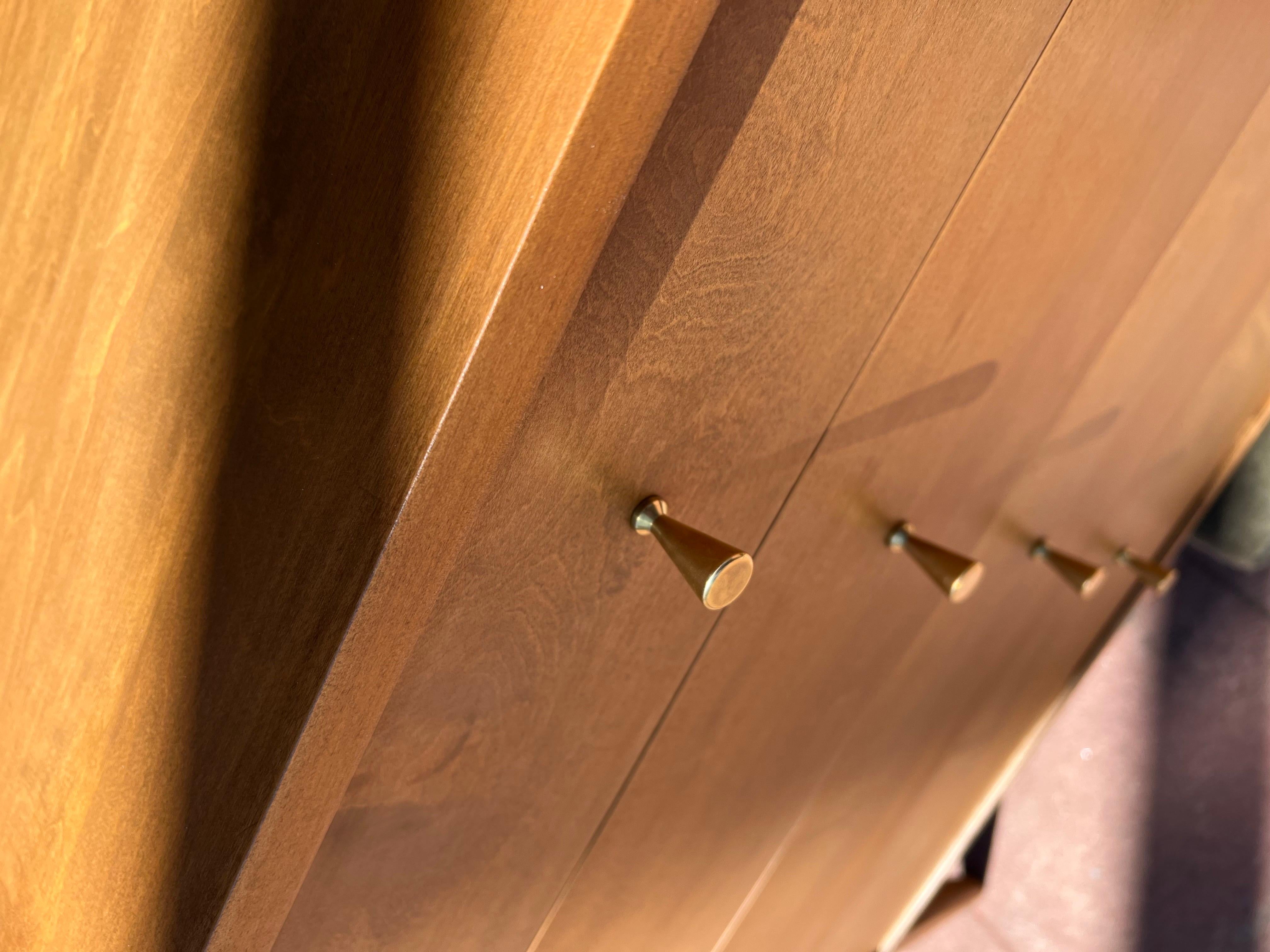 A beautiful hard-to-find freshly refinished dresser, by Paul McCobb, circa 1950's beautiful solid polished brass knobs and a double drawer top for more storage, part of the planner group modular solid wood great quality. the top is 24